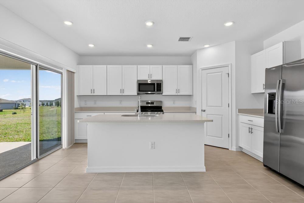 Photo of 217 Streamwater Way, Groveland, FL 34736 (MLS # TB8467820)