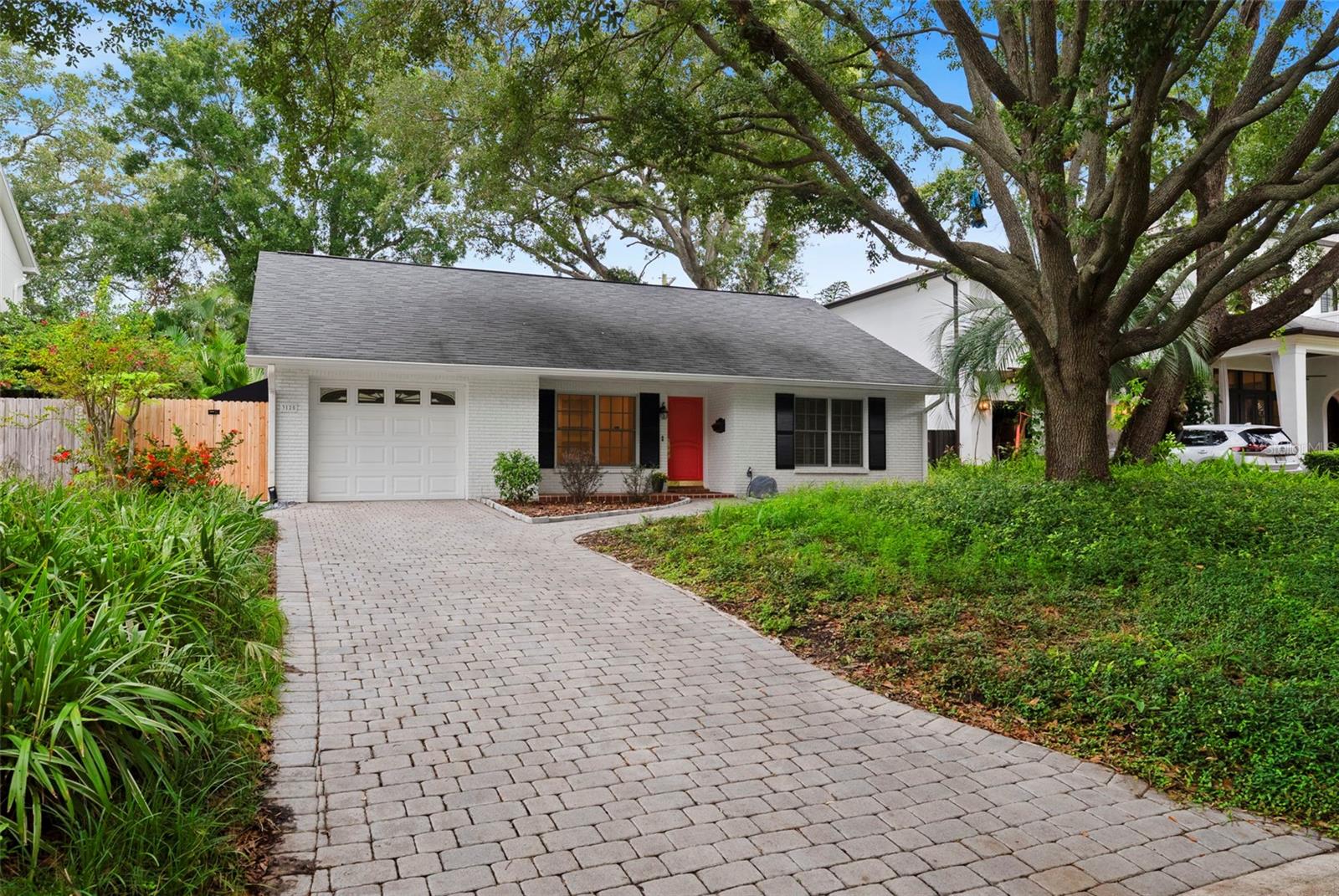 One or more photo(s) has been virtually staged. ARE opportunity to live in the coveted WAVERLY PARK NEIGHBORHOOD of South
Tampa RIGHT ON THE PARK! This home is fully redone inside, with hardwood floors, custom windows, spacious rooms, and higher ceilings - it lives larger than the square footage shows! The additional enclosed all-glass
sunroom adds to the total, bringing the space to almost 1400 sq ft. A separate living room and larger family room with dining area is off the ample kitchen (lots of all-wood cabinetry and granite countertops, stainless steel
appliances included). The separated master bedroom at the back of the home offers an en-suite bath and walk-in closet, while the second bedroom up front is perfect for a
little one or even an in-home office. A nicely sized hall bath and a full wall of storage closets offer loads of storage, too! All appliances incl. washer & dryer included. Available immediately! 7 mos lease
