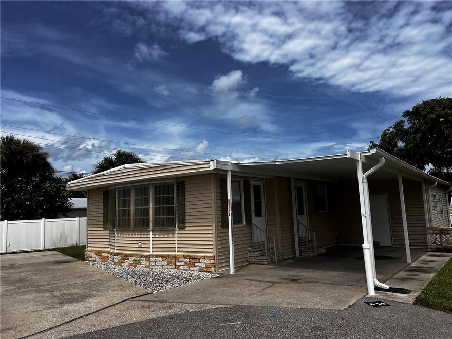 Welcome to this charming 2-bedroom, 2-bath manufactured home in the desirable 55+ community of Alligator Park. Perfect as a seasonal retreat or a comfortable full-time residence. This home offers 1,029 sq ft of interior space, a 13' x 44' covered carport and a 12' x 19' shed and includes an added concrete pad next to home for extra parking.  Home has a spacious layout with a kitchen and dining area, large living room, and a great room for entertaining and relaxing.

The master suite features a large walk-in closet and a private bathroom with stand-up shower, while the guest bath includes a tub/shower combo. Bedroom 2 has large closet and window. The carport with attached shed houses the washer, dryer, & water heater, and includes additional storage space. Shutters on the windows offer extra protection and peace of mind.

Situated at the end of a quiet cul-de-sac, this property had no flooding during last year’s hurricanes. While the home could use a little TLC to make it your own, it’s attractively priced at just $90,000 and includes the lot share.  Located in an X Flood Zone.

Residents of Alligator Park enjoy a clubhouse, community mailbox, huge, heated pool, and an active social calendar. Low monthly HOA fee of $290 that covers Water, Sewer, Internet & more + Golf Carts are acceptable in Alligator Park. Conveniently located just minutes from US-41 and I-75, and only 10 minutes to downtown Punta Gorda, you’ll have easy access to farmers markets, waterfront dining, boutique & grocery shopping, public boat ramps, the scenic Harbor Walk, and more.

Don’t miss this opportunity to enjoy affordable Florida living in a friendly community—schedule your showing today!