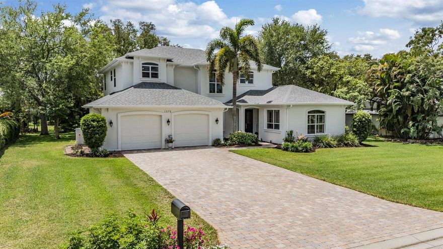 One or more photo(s) has been virtually staged. Welcome to your private slice of paradise in the heart of Dunedin—where luxury living meets an unbeatable coastal lifestyle, just minutes from the Dunedin Causeway, Honeymoon Island, and the Pinellas Trail. This stunning custom-built pool home is a true showstopper, offering 4 bedrooms, 3 bathrooms, a dedicated bonus room, and over 3,460 square feet of thoughtfully designed living space. From the moment you step inside, you’re greeted by an impressive open two story foyer with formal dining area & living room, highlighted by a custom wrought-iron staircase and sliders that invite natural light and seamlessly connect to the outdoor oasis. At the heart of the home, the gourmet chef’s kitchen is designed to impress—featuring stainless steel appliances, a 5 burner gas cooktop, built-in double convection ovens, granite countertops, bread cabinet, lazy susan, a spacious island, breakfast bar seating, and a charming dinette perfect for casual dining. The adjoining family room is both warm and inviting, complete with custom built-ins, a gas fireplace, and direct access to the lanai—ideal for effortless indoor-outdoor entertaining. The first-floor primary suite is a luxurious retreat, offering a generous walk-in closet, storage closet and a spa-inspired en-suite bath with dual vanities, a walk-in shower, and a relaxing soaking tub. A second downstairs bedroom is perfect for guests, while a separate office/workstation provides a quiet and functional space for remote work or study. A full pool bath adds convenience and accessibility. Upstairs, a spacious bonus room creates endless possibilities—whether it’s a media room, game room, or lounge. Two additional bedrooms, each with large walk-in closets, share a well-appointed Jack-and-Jill bathroom. Step outside and escape to your own tropical sanctuary. The covered pavered lanai overlooks a sparkling heated saltwater pool with a spillover spa, all surrounded by lush, private landscaping. A separate pavered fire pit area sets the scene for cozy evenings under the stars. Additional highlights include a large first-floor laundry room, a 756 sq ft garage with custom built-in cabinetry, a tankless water heater, security system, and an extended paver driveway. With no HOA and a prime location near top-rated beaches, parks, dining, and shopping—plus easy access to Tampa International and St. Pete airports—this exceptional home truly has it all. This is more than a home—it’s a lifestyle.
