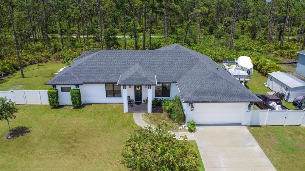 Photo of 12078 Chapman Ave, Port Charlotte, FL 33953 (MLS # A4661860)