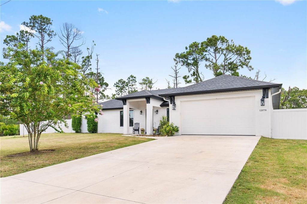 Photo of 12078 Chapman Ave, Port Charlotte, FL 33953 (MLS # A4661860)