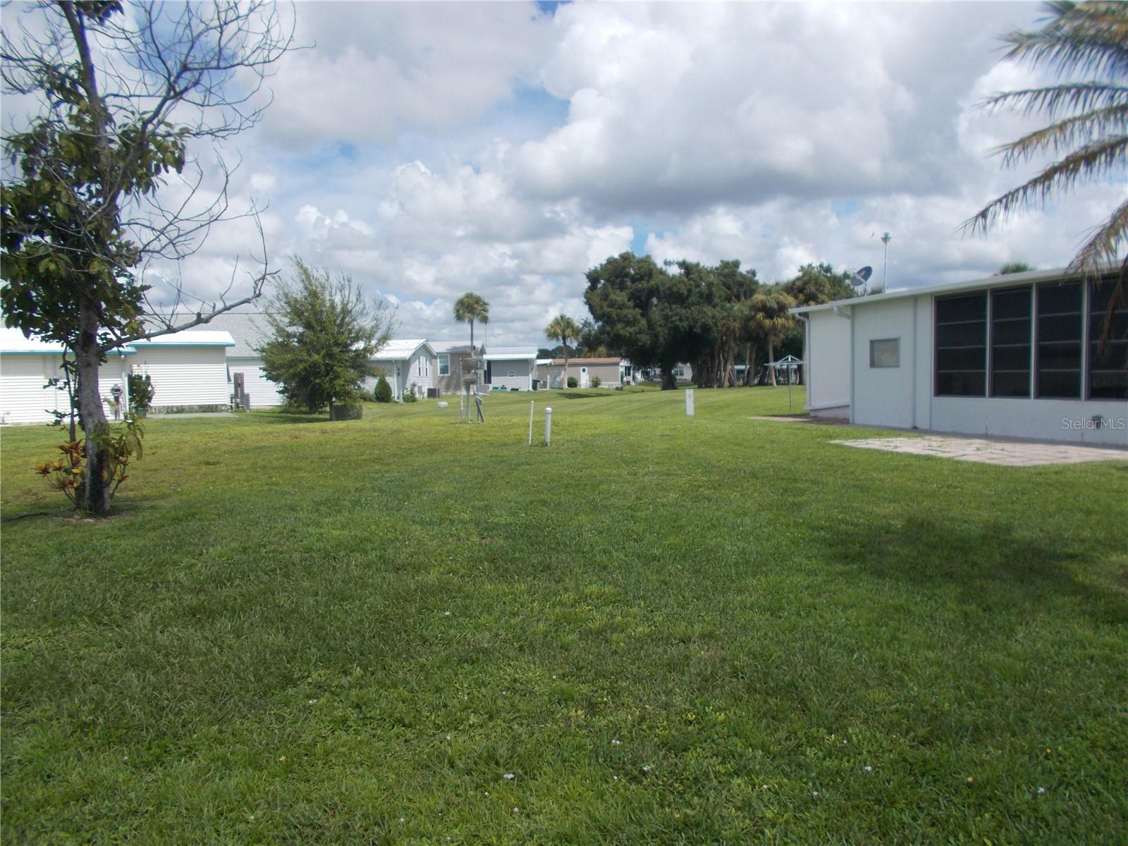 Vacant land in the sought after 55+ Gated Community of Holiday Park and it is in the PET SECTION. The land is located on Holiday Park Blvd. and the cross street is Blossom Lane. This is a large parcel (5560 square feet) with 2 trees in the front, one of which is a palm tree. In Holiday Park you own the land with a deed and the maintenance fee of $2340.00 a year ($195.00 a month) is included in your taxes. Holiday Park offers many amenities including 2 Pools, Tennis Courts, Pickle Ball, Bocci, Shuffleboard, Laundry, Library, Horseshoes, Bingo plus other card games, Fitness Room and so much more. This home has been pulled. This is a perfect place for your new manufactured home. Come and see!