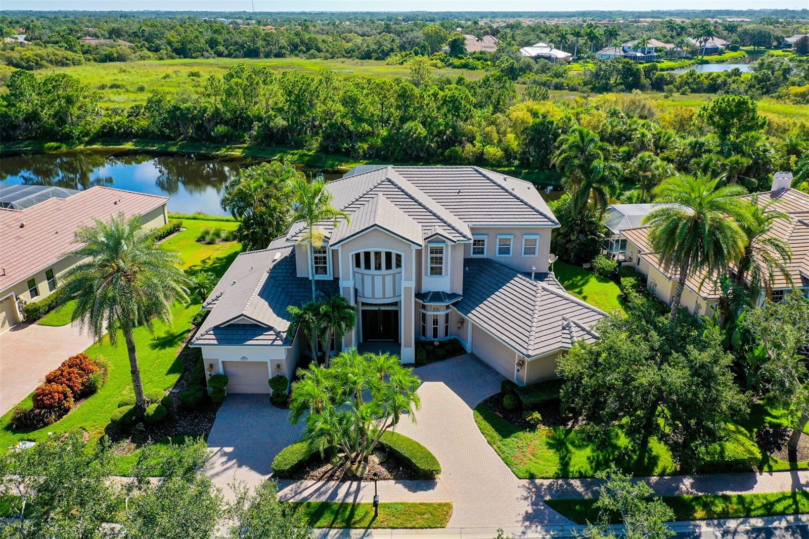 Under contract-accepting backup offers. A truly one of a kind executive home custom built by one of Sarasota's best luxury builders "Bamboo Builders"* Situated on one of the best lots in Silver Oak with lake views backed by acres of private preserve* This home exudes timeless European elegance in every way* Classic finishes with custom cherry & mahogany wood cabinetry & built ins* Nearly 5,800 sq. ft. of architectural elegance with 4 generous bedrooms, 4 full baths & beautiful office with custom built ins* High ceilings* Upstairs features a large guest bedroom with bath and an enormous 48x41 bonus room & outdoor balcony* $60,000 in hurricane shutters & a recently re-built 2 story caged lanai approx. $46,000* 2 gas fireplaces* Upstairs furniture included downstairs furniture available at additional cost* Large screened pool/spa area with outdoor kitchen, paver brick floor & outdoor fireplace* 3 car garage with specialty flooring* Silver Oak is centrally located on Palmer Ranch near shopping, short distance to world famous Siesta Key beaches, restaurants, golf & Legacy Bike Trail*