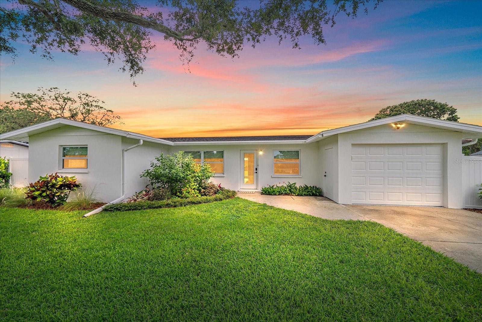 This exceptional two-bedroom, two full and one half -bathroom home offers an impressive blend of modern upgrades and thoughtful design on a generous one-third acre lot. The property features a meticulously updated kitchen with contemporary appliances and stunning quartz countertops that extend seamlessly to the outdoor entertaining areas.
The heart of the home showcases custom finishes throughout, including tailored closets and blinds, while impact windows provide peace of mind and energy efficiency. A dedicated office doubles as a pool room with an additional half bath, creating flexible living space for work or recreation.
The outdoor oasis truly sets this property apart, featuring an upgraded patio with custom television wall and elegant wood plank ceiling details. A striking fireplace creates the perfect focal point for gatherings, while the entire space flows effortlessly for entertaining.
Recent infrastructure improvements ensure worry-free living, including a 2018 AC, 2020 electrical panel, complete repiping in 2012, and roof replacement in 2015. The refinished garage boasts durable epoxy flooring, complemented by impact-resistant garage doors. A RV lift station is installed on the property.
Additional premium features include impact sliders, vinyl fencing for privacy, and the convenience of no HOA. The property comes fully furnished, allowing for immediate move-in comfort.
Located in a desirable Sarasota neighborhood, residents enjoy convenient access to quality schools, public transportation, popular shopping destinations like Trader Joe's, and beautiful Siesta Key Beach for outdoor recreation. This remarkable home represents an outstanding opportunity to embrace Florida living at its finest.