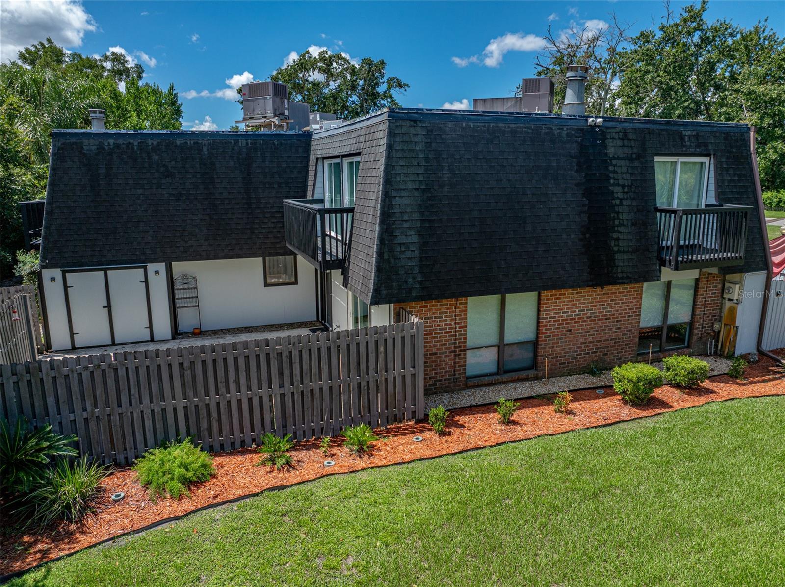 Welcome home to this beautiful 3-bedroom, 2.5-bath townhouse offering over 1,750 square feet of comfortable living space across multiple levels. Perfectly blending functionality with charm, this home features multiple outdoor areas and a warm, inviting interior. The main level boasts an open-concept layout, where the spacious living area flows seamlessly into the dining room, anchored by a cozy fireplace that adds warmth and character. The living and dining areas are bathed in natural light, thanks to generous windows that infuse the space with warmth and a sense of openness. The adjacent kitchen is well-equipped with ample cabinet space and modern conveniences, ideal for both everyday living and entertaining. Conveniently located on the main floor, the half bath includes storage space and a dedicated laundry area with a washer and dryer. Upstairs, you'll find three generously sized bedrooms, including a primary suite with a private balcony and en-suite bath. A second balcony off a guest bedroom provides additional space to enjoy fresh air and morning light. Step outside to a fully fenced patio, perfect for outdoor dining, gardening, or simply relaxing in your own private retreat. With two balconies and a serene patio, this home offers exceptional indoor-outdoor living.
The home has been well maintained, including some recent updates. The sliding glass doors in the living room have been recently replaced, adding to the abundance of natural light throughout the space. The main level ceilings have been refreshed by the removal of outdated popcorn texture, and all of the walls have been freshly painted giving the interiors a clean, modern look and feel. The large balcony off the guest room has been fully replaced, and the balcony off the primary suite has brand new railings, adding both safety and style.
Centrally located near shops, parks, and public transit, this move-in ready townhouse combines modern comfort with classic charm. Don’t miss this unique opportunity!
