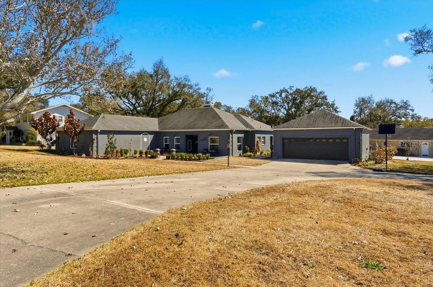 Here's your chance to live in the beautiful, gated community of GLENMORE where you will have full access to SCOTT LAKE and a community BOAT RAMP/tennis courts and common grounds. This charming, fully remodeled 3-bedroom, 4 bath home offers 2,988 sq ft of thoughtfully designed living space, blending modern upgrades with everyday functionality. And wait until you see the kitchen! Custom granite, large island and plenty of custom cabinetry. The open and bright living room features a wood burning fireplace with plenty of room for family or entertaining guests. New luxury vinyl flooring, new windows, new doors, practically new everything. The home features a three-zone AC system, ensuring comfort and efficiency throughout.  Every inch has been updated, delivering a fresh, move-in-ready feel with cohesive finishes and timeless appeal. You may even enjoy doing laundry in the ample sized laundry room that also features a half bath.  The second bedroom (which could also be a 2nd primary bedroom), features a full bath also. 
Situated on a large corner lot, the property makes a grand first impression with a circular driveway and a detached two-car garage that goes well beyond storage.  Inside the detached garage, you'll find a dedicated 12x10 workshop, which is vented for air, and a big office that measures 14x12, that is also vented for A/C, ideal for remote work, a man-cave, 4th bedroom or a hobby room. The space to spread out and the possibilities are endless. The roof is approximately 7 years old, there are two hot water heaters and a newer septic tank and drain field.  This beautiful corner lot is over 1/2 acre with numerous fruit and flowering trees and a large circular driveway.
Out back, enjoy Florida living at its best with a new, inground pool and ample space for entertaining or relaxing in private. 
You'll enjoy the gated security, access to Scott Lake with a community boat ramp, tennis courts, gazebo and beautifully maintained common grounds, creating a lifestyle that feels both peaceful and connected. 
This is a rare opportunity to own a fully updated home with lake access and all in one of the area's most desirable gated communities. Conveniently located near shopping, dining, medical and easy access to the Polk Parkway and I-4.  Call for your private showing today!