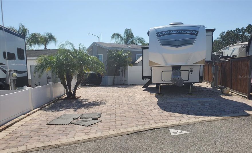 ONE OF NATURE'S GIFTS TO NUDISTS!  SUN YOUR BUNS YEAR ROUND LEGALLY WHEN YOU OWN THIS IN AND OUT RV LOT FULLY PAVED AND WITH A STORAGE SHED.  This lot was developed so an RV, 5th wheel, or pull behind can be pulled straight in and driven straight out with ease.  The super Clubhouse offers a large gathering room, coin operated laundry, his and hers bathrooms/dressing area and inside mailboxes.  You will love the pool area with a canopy shade and a large picnic and fun area to meet and mingle with other residents.  Fully fenced and gated for privacy and security.  Low HOA fee includes Common Area Taxes, Community Pool, Insurance, Maintenance Grounds, Pool Maintenance, Private Road, Sewer, Trash, Water.  This is a great lot at a great price.  Call today to get a full tour of the lot and community.  Located in the heart of Land O Lakes, Fl this is one of the best nudist RV parks in the state of Florida.  This could be your piece of Paradise for just $80,000.