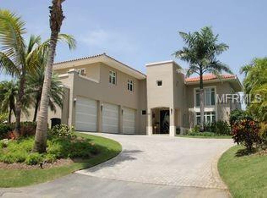 Fabulous luxury home, with exquisite surroundings and flawless design! A turn-key two story residence full of natural light, sunshine and nature! It consists of 4 spacious en-suite bedrooms, living room, open concept chef’s kitchen with elite stainless steel appliances that lead to the family room, breakfast area and dining room. The elegant entrance with paved driveway and beautiful landscaping leads through a modern custom-made door to the elegant living room with high ceilings. A great house for entertainment, or just relaxing …enjoying the spectacular tropical landscape with lush vegetation, resort-style saline heated pool and hot tub with waterfall, in pool table with umbrella, fire features and lighting system. The location of this house can’t be beat, in the heart of Dorado Beach East, near Plantation gym and the watermill park, with easy access to paradise beaches in your golf cart. You will be steps away from an exclusive golf club, fitness center, water sports facility, delicious dining and more!... all surrounded by lush vegetation and breathtaking landscape. Ready to start enjoying the tropical splendor that this luxurious home in the best neighborhood of Puerto Rico can offer you and your family? Don’t think it twice! Call or e-mail us now to make an appointment!