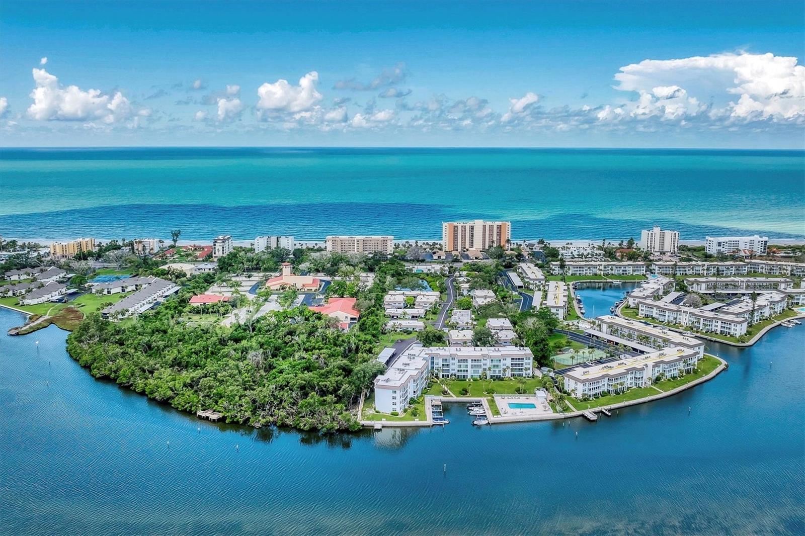 Available for immediate occupancy! GULF BEACH and BAY ACCESS! This single story end unit is the perfect place to escape the cold winter months and experience Island living on Longboat Key. This 2 bedroom, 2 bathroom condo has a spacious living and dining room combo, which opens to a bright and airy Florida room, perfect for relaxing or entertaining. The Florida room is fully enclosed, and windows and sliding glass door have screens to welcome in those lovely Gulf breezes. The kitchen is well appointed and fully furnished with everything you may need to cook and enjoy meals at home and there is also a utility room with a washer and dryer for your convenience. The primary bedroom is comfortably furnished with a queen bed and en-suite bathroom. The second bedroom is currently empty and the owner will happily furnish it to meet your needs - either as a second bedroom or a den. Sutton Place offers private Gulf beach access complete with a pavilion, picnic tables, restrooms and showers. Additional amenities in the community include 2 heated pools, one of which sits on the Sarasota Bay, barbecue areas for al-fresco dining, bicycle storage, kayak storage and launch and fishing dock. Boat docks are also available for lease at a low rental fee based upon availability. The community is only 1/2 mile from Bayfront Park of Longboat Key, where you can utilize the park's 3 pickleball courts, tennis courts, basketball court, shuffleboard courts and more! Located just a short drive from St. Armand's Circle with wonderful shopping and dining venues or head North to visit the beaches of Bradenton, Coquina, Holmes and Anna Maria Island. This turnkey furnished condo is available for a 4 month minimum rental period. Rental rates vary based on the season and are as follows: January-April: $4,300/mo. May-September: $2,800/mo. October-December: $3,300/mo. Annual rental: $3,000/mo.
