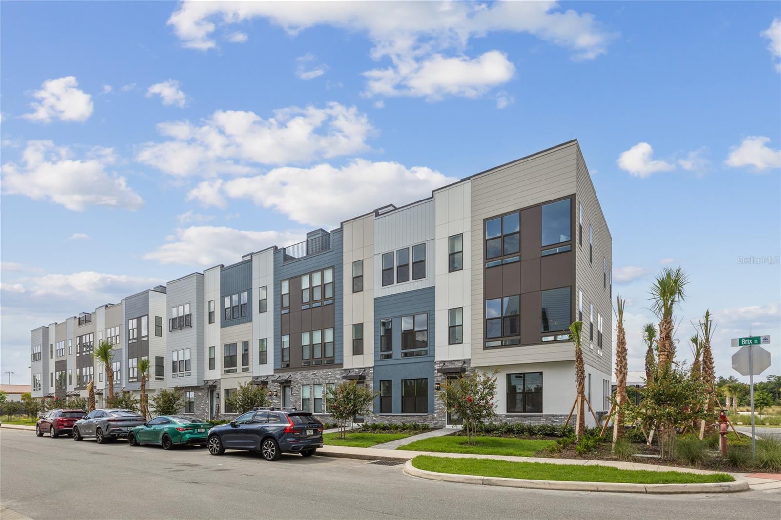 Welcome to The Brix, an exquisite 4-story townhome that lives more like a single-family home, featuring 3 bedrooms and 3.5 bathrooms — plus a stunning rooftop terrace! Enjoy courtyard views from the front and open space park views from the back, offering a rare blend of privacy and nature. The first floor offers a convenient bedroom and full bathroom, perfect for guests or a home office. On the second floor, the gourmet kitchen shines with gray cabinetry that is extended to the ceiling along with the upgraded backsplash, upgraded quartz countertops, high-end KitchenAid gas appliances, a spacious center island with breakfast bar, and a large walk-in pantry. Upstairs, the third floor hosts a luxurious primary suite with a generous walk-in closet, along with a second bedroom, full bathroom, and a well-placed laundry room. The Brix is perfectly situated within close distance to popular amenities including scenic walking/biking trails, the Orlando Tennis Centre, and the YMCA. Schedule your private tour today and experience the elevated lifestyle at The Brix!