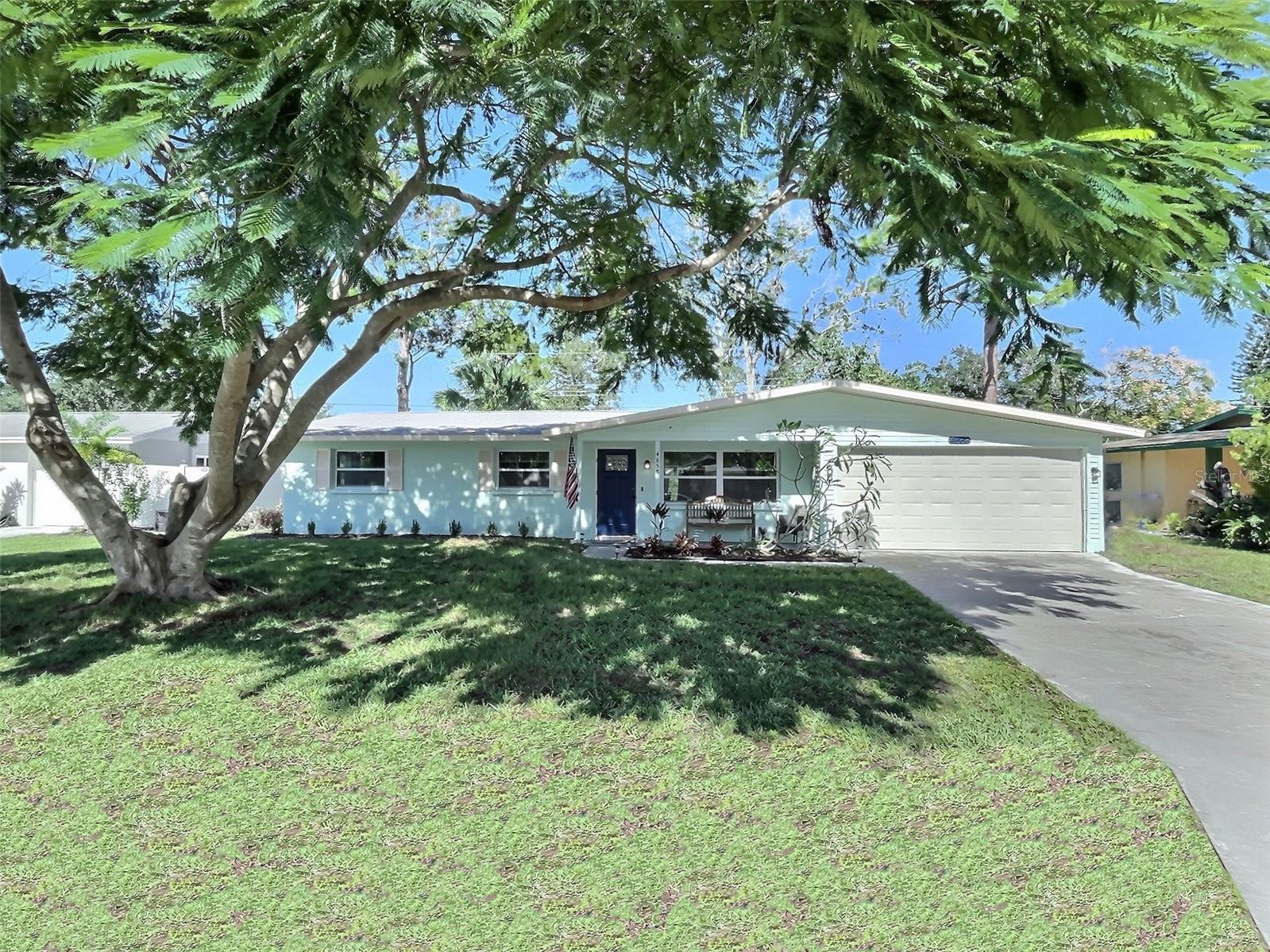 Summary: Beautifully updated modern but warm ranch style home in the heart of Sarasota. Open living space both functional and comfortable for you and your guests. Fully stocked kitchen fit for most all your cooking needs with ample seating for dining with family and friends overlooking a spacious backyard offering covered lounge seating. Did I mention a kid friendly zone excellent for hooking up their system of choice and gaming or watching their favorite movie for the 20th time. The home is clean, the beds are comfortable, and the neighborhood is quiet.
The home in detail: Arrive under the cool shadows of the Royal Poinciana tree framing this single floor, ranch style home. Navigate the short walkway to the front door and admire the quaint front porch seating area. Step in through the vibrant blue front door into an open living space decorated and furnished with warm neutral tones setting you up for success of a relaxing stay. The living room area is furnished with comfortable lounge seating and equipped with 70” smart TV. One of the couches does have a fold out full-size bed suitable for an overnight guest but not an entire stay. Also in this area is a desk for doing some surfing (not yet on the water, that comes later). The living space lends itself to an open dining and kitchen area. The dining area offers seating for 8 overlooking the backyard and patio through glass sliding doors. A moderately sized but beautifully appointed kitchen offers a 4-pieces stainless steel appliance set among other small kitchen appliances. Fully stocked for most all your cooking needs from pots & pans to dinnerware and more. At the end of the somewhat galley style kitchen is a door to sanity, lock your kids in there and enjoy a romance movie on the big screen. The kids / laundry room is completely finished and equipped with washer/dryer, TV with console hookup, and futon. Back through the kitchen and back through the living room you get to the sleeping quarters of this home. The master suite located the furthest from the living area is furnished with king-size bed, nightstands and lamps with USB ports, a barn door leading into the en-suite bathroom equipped with single vanity and stall shower. Across the hall you come to the first of two guest bedrooms. One furnished with a queen-size bedroom set while the other is furnished with two twin beds which can be combined into a king with available bridge. The two guest bedrooms share a bathroom with double sink vanity and tub/shower combo. The backyard offers a large patio area offering a BBQ grill and pergola covering the outdoor patio seating. Surrounding the patio is ample grassy backyard area.
Location, location, location: The home is located in the heart of Sarasota locating it just 10 minutes to Siesta Key and it’s beaches as well as Downtown Sarasota at just 10 minutes as well; offering additional shopping, restaurants, and nightlife options. The Amish winter haven called Pinecraft is also just a short drive north from the home to enjoy some excellent Amish restaurants and more. Additionally you have a quick drive to the nearest highway to shoot up to Tampa, St. Petersburg/Clearwater areas. Ride sharing services are readily available in the area.
the garage is not available for use.
