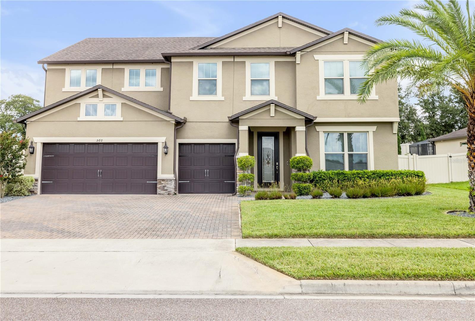 So many options! Ideal for multigenerational living, extended families, or those working from home. This 2018 home offers three private bedroom suites, including a spacious owner’s suite and an expansive secondary suite, which can easily be converted back into a 4th bedroom. The main floor also offers a large flex room situated next to a guest bathroom, making it ideal as an office or a 5th bedroom. Multiple living areas include a generous open downstairs family room and an upstairs loft. The gourmet kitchen features a massive island with abundant under cabinet storage, gorgeous light fixtures, whisper-quiet dishwasher, double ovens, and an incredible 12×5 pantry. Perfect for entertaining, the kitchen overlooks the main living area with a modern electric fireplace. Throughout the thoughtful layout of this home, you'll find more closet space then you'll know what do with. Additional highlights include a mudroom waiting to be customized, a laundry room that could fit 2 washers and dryers and still have space, and your own theater room with screen and projector. The 3-car garage and paver driveway offer ample parking for family and guests. Don't forget the backyard’s expansive paver patio, with built-in swing and firepit, and room to add a summer kitchen. All while offering a low-maintenance yard and a nearby community playground. Located between two of Central Florida’s natural springs and near the Northwest Sports Complex, just 2.5 miles from SR 451 connecting you to SR 429 and the Florida Turnpike for an easy commute, and just minutes to shopping, dining, and everyday conveniences, this move-in ready home blends versatility, space, storage, and location.