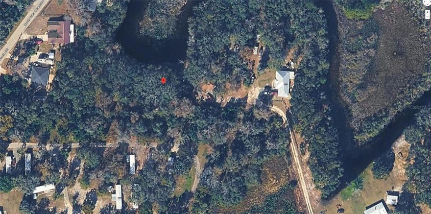 Rare Waterfront Opportunity in Citrus County! This prime 0.28-acre residential lot is perfectly situated on a canal in the tranquil Marina City subdivision of Inverness. Boasting approximately 85 feet of canal frontage and direct water access, this property is a dream for those looking to build a custom retreat in a "Coastal Lakes & Rivers" zoned area. Enjoy the peaceful surroundings of the Turner Camp Road Area, where you are just moments away from the natural beauty of Florida’s waterways. The lot features a unique shape with generous dimensions, including a 170-foot rear boundary and depths up to 121 feet, providing a versatile footprint for your future home. Key Features:Location: 7089 E Leaning Oak Dr, Inverness, FL Size: 12,165 Sq. Ft. (0.2793 Acres) Waterfront: Canal Front Zoning: CLR (Coastal Lakes & Rivers) Community: No active HOA listed, located in the Marina City Unrecorded Subdivision