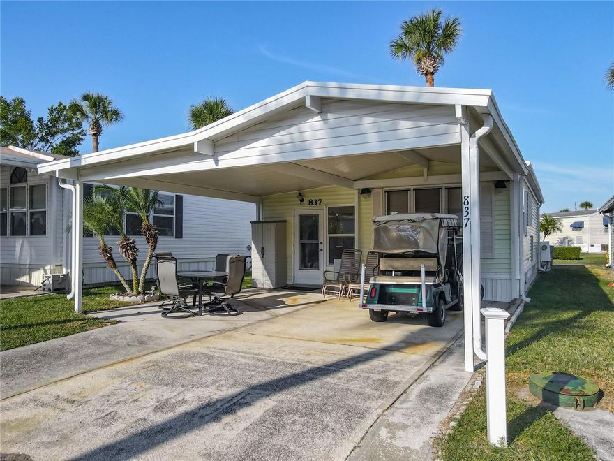 Huge double carport (added in 2016) gives great curb appeal and welcomes you to this comfortable, inviting home.  This wonderful outdoor space is most certainly an entertainers delight!!   The home benefits from a NEW ROOF in 2024, NEW A/C 2023 and is being sold fully furnished and equipped as seen and also includes the GOLF CART, SMOKER BBQ and 2 bikes (all are in working order and included 'strictly As Is'). Seller is offering a $4,000 credit at closing for plumbing replacement. Come take a look at this highly sought after 55+, guard gated community of Outdoor Resorts! NO LOT RENT - YOU OWN THE LAND!! .   Come and experience the fantastic lifestyle that this unique community offers. Amenities include 2 heated swimming pools; private access to a 179 acre lake (Lake Davenport); 9 hole golf course; tennis; pickleball; shuffle board; 9 hole putt-putt golf; 8 bath houses scattered throughout the community; laundry facilities; beautiful 2 story clubhouse offering an endless array of entertainment throughout the year. All of this for the low Association Fee of $768 per quarter which also includes Cable TV, Lawn Mowing, Sewer, Trash and Water. UNBELIEVABLE VALUE FOR MONEY - you won't find a more AFFORDABLE LIFESTYLE !!!! Please remember 55+, no VA or FHA financing, 1 pet rule. The park benefits from close proximity to DISNEY, medical facilities, restaurants & grocery stores. Don't delay!! Put this home on your 'must see list' and ask to arrange a viewing today.