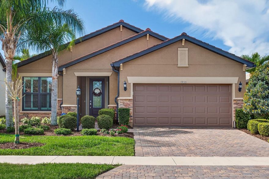 If you snooze, you’ll miss out on this exceptional opportunity! This immaculate Martin
Ray model, built in 2016, has been meticulously maintained and is perfectly situated on
a premium water view lot with desirable north/south exposure—ideal for embracing the
Florida lifestyle. Discover this stunning home in a highly sought-after 55+ community,
nestled within Lakewood Ranch, the nation’s top-rated multi-generational master-
planned development. Offering 3 bedrooms, 2 bathrooms, and a versatile flex room, this
thoughtfully designed home provides both comfort and flexibility for everyday living. A
third bedroom was added as a builder upgrade, while the flex space is enhanced with a
chair rail detail, making it ideal for a home office or hobby room. The home’s inviting
curb appeal is elevated by natural stone accents and a well-manicured lawn. Inside,
you’ll find 18” neutral ceramic tile flooring throughout, complemented by crown molding
and 5 ¼ baseboards for a polished, elegant look. Designer lighting fixtures and ceiling
fans added a modern touch throughout the home. The upgraded kitchen is both stylish
and functional, featuring premium KitchenAid stainless steel appliances, including a 5-
burner gas cooktop with wood canopy hood, built-in oven and microwave, quartz
countertops and backsplash, and a French door refrigerator. A charming coffee and
wine nook with cabinetry and a wine refrigerator adds convenience and sophistication.
The owner’s suite is a relaxing retreat, highlighted by a tray ceiling and a luxurious
ensuite with wood framed mirrors, a frameless glass walk-in shower, soaking tub, and a
custom wood walk-in closet with built-in drawers and shelving. Guest accommodations
are thoughtfully separate to provide privacy and comfort. Step outside to the extended
lanai, where you can unwind or entertain while enjoying tranquil water views. The space
features a 4-person hot tub and Kevlar hurricane rated remote screens, allowing for
year-round enjoyment. Additional upgrades include hurricane shutters, select hurricane
impact glass, a whole-home surge protector, and plantation shutters throughout. The
custom painted garage is equally impressive, featuring epoxy flooring, cabinets and
drawers and a convenient drop zone at the entry into the home. This exceptional Martin
Ray Model offers a perfect combination of upgrades, functionality, and location—ready
for you to move in and enjoy.