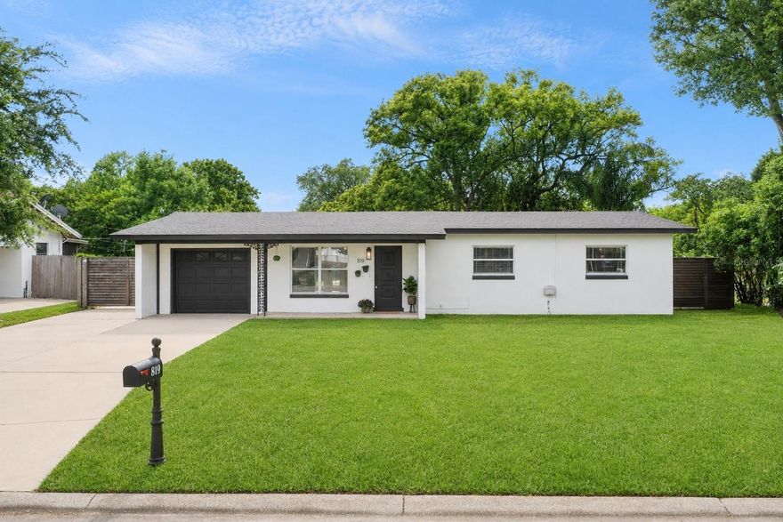 Welcome to 819 Densmore Drive, a beautifully refreshed concrete block ranch home in the heart of Winter Park Estates, one of Winter Park's most established neighborhoods with no HOA. This move-in ready home checks every box for buyers who want turn-key condition with an accessible price and a coveted Winter Park address. From the moment you pull up, the curb appeal speaks for itself. A crisp white exterior with fresh paint, an extra large driveway with RV, Boat, or trailer parking, and a lush green lawn, sit against the quiet, tree-lined street that makes this neighborhood so beloved. Step inside and you'll notice the brand-new Palmer Oak Rigid Core Luxury Vinyl Plank flooring running throughout the entire home, installed in 2026! It delivers the warmth of hardwood with the durability Florida living demands, and ties every room together beautifully. The interior was freshly painted top to bottom in 2026, giving every room a bright, clean feel that makes the home feel completely renewed. The layout is open and functional, with generous living areas, a dining room anchored by a chandelier that stays with the home, and bedrooms filled with natural light and ceiling fans throughout. The kitchen comes equipped with the refrigerator included, a functional breakfast bar, recessed lighting, and plenty of storage. Blinds, decorative framed bath mirrors, ceiling fans, and keypad entry all stay. Both bathrooms received new vanities and toilets in 2026, delivering a completely fresh, modern look. The big-ticket systems are solid. The roof was replaced in February 2022. The HVAC system is less than two years old. The plumbing was repiped to PEX in 2016, and the home connects to city sewer, public water, and public irrigation. No well, no septic, no solar obligations. Clean, uncomplicated ownership. The backyard is shaded by a mature tree with room to spread out, BBQ, add playgrounds, pools, or bounce houses, and the property sits high and dry away from flood zones. Zoned for Lakemont Elementary, Maitland Middle, and Winter Park High School, this home places you in one of Orange County's most sought-after school districts. Minutes to Park Avenue dining and boutique shopping, Advent Health Winter Park, Winter Park Pines Golf Course, the Cady Way Trail, and easy access to SR-436, Aloma Avenue, and the 408. Winter Park Estates is the kind of neighborhood where properties like this, genuinely updated and truly move-in ready in a community this well-established and well-located, don't sit long. Schedule your showing today.