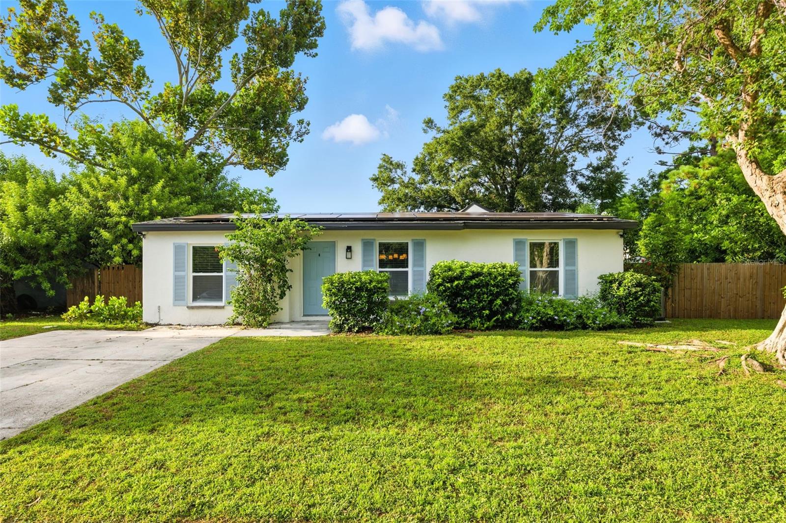 Welcome to your X-Flood Zone dream retreat — where timeless design meets modern functionality. Completely reimagined and move-in ready, this 4-bedroom, 2-bath residence sits on just under a quarter-acre in one of the area’s most desirable neighborhoods. Every detail has been thoughtfully updated for style, comfort, and peace of mind. Enjoy FULLY-PAID OFF SOLAR PANELS at closing, NEW A/C (2024), NEWER PLUMBING (2022), COMPLETE electrical rewire with NEWER panel (2022), NEWER water heater (2022), NEWER ROOF (2015), NEW washer and dryer, CUSTOM Elfa shelving in ALL closets, and blown-in insulation for year-round energy efficiency. Inside, a bright, open-concept layout creates the perfect backdrop for both everyday living and effortless entertaining. The designer kitchen is a showstopper, featuring white shaker cabinetry, sleek quartz countertops, white-oak open shelving, and a brand-new Café smart oven with a stainless steel appliance suite—including a statement range hood. The spacious eat-in island flows seamlessly into the dining and living areas, while the massive great room with vaulted, wood-planked ceilings offers a warm, inviting space for gatherings. One of the home’s most captivating features? A custom built-in bookcase that doubles as a hidden door, leading to the luxurious primary suite—a private sanctuary with style and character. Both bathrooms shine with designer tile, modern vanities, elegant lighting, and upgraded fixtures. Throughout the home, you’ll find new luxury vinyl plank flooring, updated interior doors, fresh interior and exterior paint, and stylish new fixtures and blinds. With a split floor plan, expansive lot, and thoughtful upgrades, this home stands out in today’s market. Ideally located just minutes from Lake Seminole Park, vibrant Downtown St. Pete, world-famous Gulf beaches, and endless shopping, dining, and entertainment options—with Bardmoor Elementary around the corner and South Tampa less than 30 minutes away—this property offers the ultimate blend of comfort, convenience, and lifestyle. Don’t miss the chance to make this one-of-a-kind home yours—schedule your private showing today.