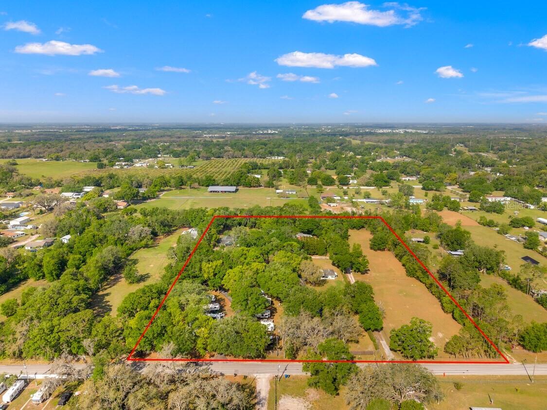 Rare 7.5-Acre Multi-Use Investment Property in Zephyrhills with Huge Expansion Potential - Includes 14-Lot RV Park on 3 acres with steady long term tenants plus Approx. $3000 sq. ft. Home on 2 acres plus 2 Chariot Park Model Homes plus Concrete Block Club House & Office Space plus Adjacent 2.44 Acre Vacant Lot - Clear, High & Dry, No flood zone.
This unique approximately 7.5-acre multi-building property presents an unparalleled income-generating opportunity in one of Florida’s fastest-growing markets! Featuring four well-maintained buildings, including 3000 sq. ft. 4 bedroom, 2 Bath home, a 14-lot RV park, and adjacent vacant land, this property offers multiple revenue streams and huge upside potential. Located just off State Road 54, it provides easy access to major highways, Downtown Zephyrhills, Wesley Chapel, and Tampa, making it an ideal long-term investment
14-Lot RV Park on 3 Acres mol : Full hook-ups with 50 amp electric, county water, and septic system, Generous 40' x 65' lots to accommodate large RVs, utility sheds, and parking, High and Dry location with strong potential for expansion or redevelopment
Currently undervalued rental rates, offering immediate upside for new ownership
Includes Two Chariot Park Model Homes: Each features concrete drive with attached carport, washer/dryer utility room, plus room addition.
Comfortable, long-term rental units with high occupancy potential
Concrete Block Clubhouse & Office Space: Includes a dedicated private office for park management. Two full bathrooms with showers.
Large covered front awning, ideal for community gatherings
Concrete Block Home on 2 Acres mol: 3000 sf 4-bedroom, 2-bath home with an additional office or 5th bedroom
Spacious 20' x 40' game room, Metal detached garage with large carport and extra storage buildings and carports
Fully fenced for security and privacy, security alarm, generator transfer panel, and 3 bay dog kennel
Adjacent 2.5-Acre Vacant Lot: Fully fenced and primed for RV park expansion, storage units, or future development
Provides additional flexibility for the property’s highest and best use
Located Near State Road 54: Provides easy access to Tampa, Wesley Chapel, and major commercial hubs.
Surging Real Estate Growth: Zephyrhills is a high-growth area with increasing demand for housing, RV accommodations, and commercial developments. Expanding RV Market: Florida’s RV park industry is booming, with a projected value of $658.6M by 2025and increasing traveler demand for long-term stays.
Well-Maintained Infrastructure: No damage from recent hurricanes, ensuring a turnkey investment with minimal initial upgrades required.
Additional Possible Uses: Glamping or Tiny Home Community,Office Space or Business Park, Assisted Living or Senior Housing, Event Venue or Retreat Center – Weddings, corporate retreats, festivals, and more, Truck/RV/Boat Storage or Flex Space , Short-Term Vacation Rentals
***Please Do not disturb the tenants.***APPOINTMENT ONLY***Do not walk the property without an approved appointment***
Don’t miss this chance to invest in one of Florida’s fastest-growing markets. Contact us today for more information or a private tour!