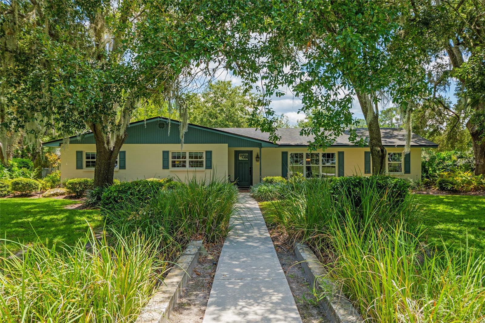 Welcome to a great pool home in the heart of it all! Nestled on a beautifully landscaped 1-acre lot, this spacious 4-bedroom, 2.5-bath home offers the perfect blend of privacy, comfort, and convenience. Mature oaks provide shade and charm, thoughtfully trimmed away from the roof for peace of mind.
Step inside to an open, light-filled floor plan featuring a remodeled kitchen (2018) with modern finishes, and updated bathrooms that add a fresh, contemporary feel. A generous Florida room opens to a large screened lanai with a sparkling pool—perfect for relaxing or entertaining year-round.
Additional highlights include a newer roof (2017), water heater (2019), and HVAC system (2020), plus newer windows throughout for energy efficiency. Enjoy the convenience of a rear-entry garage, a dedicated storage shed, a small fenced area ideal for pets, and a well for irrigation to maintain the manicured lawn.
Located in a quiet, established neighborhood that feels tucked away yet is just minutes from shopping, dining, parks, and top-rated schools—this is a rare find offering both space and serenity in a central location. Don’t miss it!