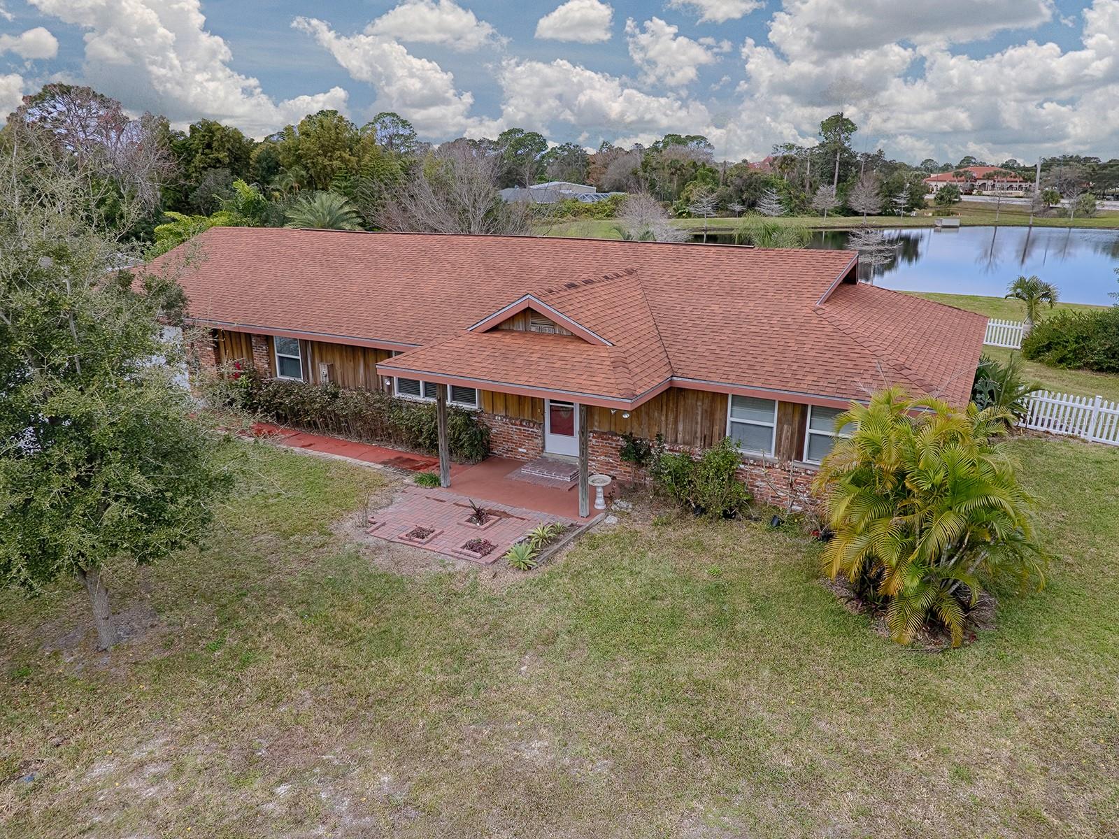 RENT OR RENT OPTION AVAILABLE. EXTRA LARGE PROPERTY CONSISTING OF 3 LOTS. 176 FT. OF BACK YARD FACING HUGE RETAINING POND FOR SERENE AND BREATHTAKING WATERVIEW. OVERSIZE MODERN KITCHEN WITH ISLAND. ABUNDANT KITCHEN CABINETS WITH BUILT IN DESK. NICE SIZE MASTER BEDROOM WITH HUGE BATHROOM W DUAL SINKS, WALK IN SHOWER, GARDEN JET TUB, AND TOILET CLOSET. 2ND AND 3RD BEDROOM DIVIDED BY A JACK AND JILL BATHROOM. EXTRA LARGE 2 CAR GARAGE TO ACCOMODATE CARS AND NICE SIZE WORK AREA. OWNER INSTALLED A HYBRID ELECTRIC HEATER WHICH DECREASED UTILITY BILL DRASTICALLY. EXTERIOR HAS LARGE TOOL SHED, VERY LARGE FENCED YARD WITH MATURE TREES AND GORGEOUS WATER VIEW. AMPLE SPACE FOR BBQ AREA, PLAYGROUND, ETC. DRIVEWAY IS XTRA WIDE AND LONG FOR SEVERAL CARS, BOAT, RV SPACE. HOUSE IS LOCATED ON NICE QUIET
CUL DE SAC STREET. EASY COMMUTE VIA I-95
