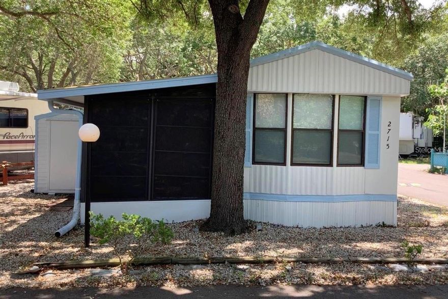 PRICED TO SELL, motivated seller! This is a beautiful, well-maintained 1-bedroom, 1-bathroom home where you OWN THE LAND! This corner lot offers privacy, space, and is located in the gated community of Clarcona Resort. The home features a large enclosed patio for extra living space, laminate and tile floors throughout, and vaulted ceilings. There is on-site management, and by living in this community, you’ll have access to a wide range of amenities, including a pool, mini golf, rec hall, playground, and golf cart-friendly roads. There is also a detached shed that has been converted into a fully equipped laundry room. The HOA covers water, sewer, trash pickup, and 24-hour gated security. 
Your home is centrally located near dining, shopping, and the 429. Come see it today!