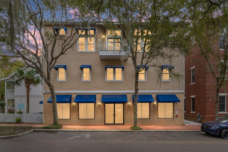 A unique opportunity awaits you in the Haile Village Center. This custom-built, three-story, mixed-use building includes an income-producing commercial space on the first floor. A private elevator provides access to your two-story, 3,700+ square foot luxury penthouse home. The third floor features luxurious finishes throughout, including wood floors, crown molding, and 15-foot ceilings. The showstopping kitchen boasts cherry cabinets, granite counters, two islands, and a Thermador appliance package. The living room/dining room combination includes a gas fireplace. This level also features a full bathroom and a theater room complete with a wet bar and refrigerator. Multiple covered balconies allow for enjoyment of the tranquil Village views and include a private summer kitchen for alfresco dining and grilling. The second floor is a quiet oasis with three full bedrooms, a study, and a gathering area. The large primary bedroom features a spacious walk-in closet and a bathroom with marble floors, a large bathtub, and a walk-in shower. The large gathering space has built-ins, a microwave, and a second wet bar area. Abundant windows provide private views of the tree-lined Village street. This premier, one-of-a-kind property is within a short distance to the restaurants, shops, and the weekly farmers market in Haile Village. The long-term tenant occupying the first floor provides rental income each month. Don’t let this unique opportunity pass you by!