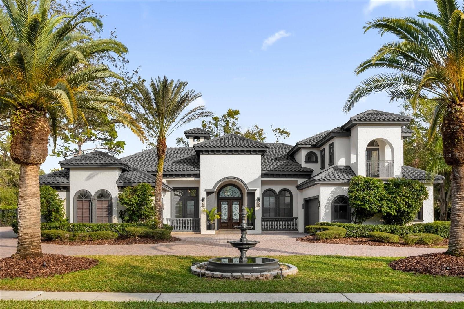 Welcome to 295 Chiswell Place, an exquisite updated, 4 bedroom single-family residence plus brand NEW CONSTRUCTION 2 bedroom GUEST HOUSE, nestled in the prestigious HEATHROW WOODS community of Lake Mary, Florida. This luxurious property offers in total 6 bedrooms, 7 full bathrooms and 1 half bath across an impressive 6,421 square feet of elegantly designed living space. This home combines thoughtful upgrades, timeless finishes, and modern conveniences from top to bottom. The main house has 4.5 bathrooms and the guest house adds 3 full bathrooms, offering convenience and luxury for all occupants. The remarkable 2,682-square-foot addition offers unparalleled space and functionality and includes spacious living areas, additional entertaining spaces, private entry, and premium finishes throughout including a BRAND NEW SAUNA. Centered between the main house and the guest house is the spectacular pool area, creating a private oasis perfect for relaxation and entertainment. The main house includes a gourmet kitchen, recently upgraded with a newer WOLF RANGE, CONVECTION OVEN and MIELE DISHWASHER for culinary excellence and features premium CAMBRIA QUARTZ countertops, and a spacious island. The home has been freshly painted inside and out with new light fixtures, updated fireplaces and feature walls, providing a polished and modern aesthetic. The luxurious primary suite includes a spa-like en-suite bathroom with a soaking tub, dual vanities, and a walk-in shower. Each additional bedroom offers ample space and privacy, with beautifully designed bathrooms. Located in the exclusive Heathrow Woods community, this property offers beautifully maintained surroundings, upscale amenities, and proximity to top-rated schools, shopping centers, dining establishments, and recreational facilities. Easy access to major highways ensures convenient commutes to surrounding areas. With its combination of elegant design, extensive upgrades, guest house, and the stunning pool area at its center, 295 Chiswell Place provides a unique and sophisticated lifestyle in one of Lake Mary's most sought-after communities.
