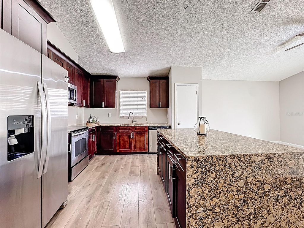 Photo of 6582 Meritmoor Circle, Orlando, FL 32818 (MLS # O6390894)