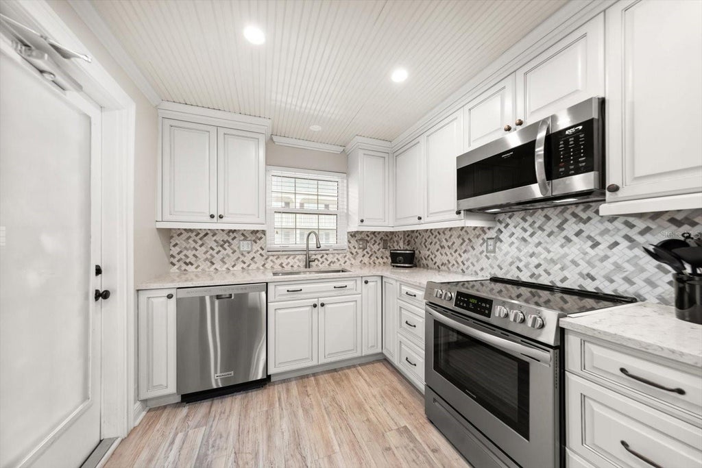 Photo of 155 Bluff View Drive #209, Belleair Bluffs, FL 33770 (MLS # TB8548933)