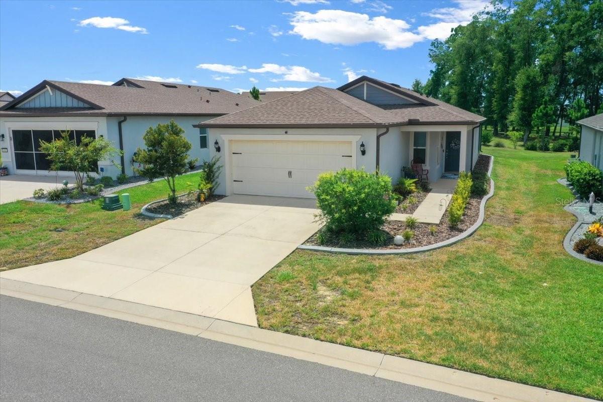 Enjoy all the benefits of newer construction without the wait. This beautiful home in Del Webb Stone Creek, set in the heart of Florida's horse country. This is Del Webb's premier community, with amenities that include an 18-hole championship golf course, full restaurant and bar, indoor and resort style outdoor pool, sport courts, and so much more. The amenities, clubs, and classes will fill your retirement days with activities, to make new friends and great memories. This Daylen floor plan features the luxury finishes you've been looking for. The designer kitchen showcases a large center island, upgraded modern white kitchen cabinets, 3crm quarts countertops with hexagon tiles backsplash, whirlpool stainless steel appliances including a range, refrigerator, dishwasher, microwave, and a washer and dryer. The bathrooms have matching cabinets and quartz countertops. Plus primary bath features walk-in shower and dual sinks. There is luxury vinyl plank flooring in the main living areas, 12"x24" tile in the bathrooms and laundry room. This 4-bedroom, 2-bath homes comes with a 2-car garage with 4' extension and utility sink. Additional features include LED lighting and smart home technology. Enjoy your morning coffee on the covered and screened lanai. From the moment you enter the this beautiful gated, with guard 55+ neighborhood you'll feel right at home and come to see why this is Del Webb's premier neighborhood. Also, you're minutes away from the world famous World Equestrian Center. Stop by to have dinner at one of their restaurants, enjoy watching world class equine events, and spectacular holiday lights. And don't forget to visit one of our local springs for a day of kayaking or just relaxing.
