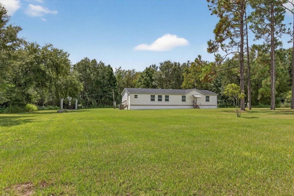 Photo of 31326 Tyndall Road, Wesley Chapel, FL 33545 (MLS # TB8431812)