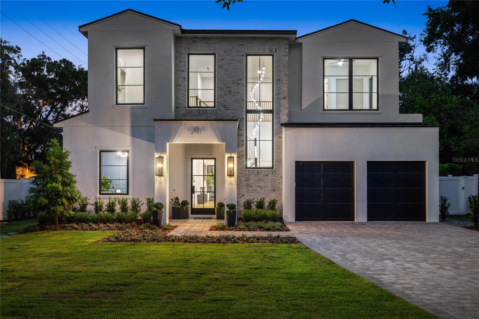 Stunning, new Winter Park residence built by Vimaro Homes exudes modern elegance and luxurious living. As you step through the glass front doors you’re immediately greeted by a custom staircase, soaring two story ceilings, and a dramatic chandelier. From the gorgeous wood floors laid in a herring bone pattern, to the designer light fixtures, and beautiful mill work, no expense was spared in the construction of this exquisite residence. The open floor plan seamlessly connects the main living areas, creating a spacious and inviting atmosphere. The home features a total of 4 bedrooms with two primary bedroom suites, plus a home office, and two laundry rooms. The chef in the family is sure to fall in love with the open kitchen, with its large center island, striking quartz countertops, custom cabinetry, large pantry, and a spectacular ILVE Nostalgie gas range & built-in refrigerator. Step outside to your own private oasis, complete with a sparkling pool, a summer kitchen and an expansive outdoor living space, perfect for hosting gatherings or enjoying quiet relaxation. The beautifully landscaped yard provides a serene backdrop and enhances the overall curb appeal of this amazing property. Walk to Blue Jacket Park or jump on your golf cart for a short trip to East End market or Park Avenue with its amazing restaurants and luxury boutique shops. The proximity of this house to everything there is to do in Winter Park is truly hard to beat. Schedule your private showing today and experience the epitome of luxury Winter Park living.