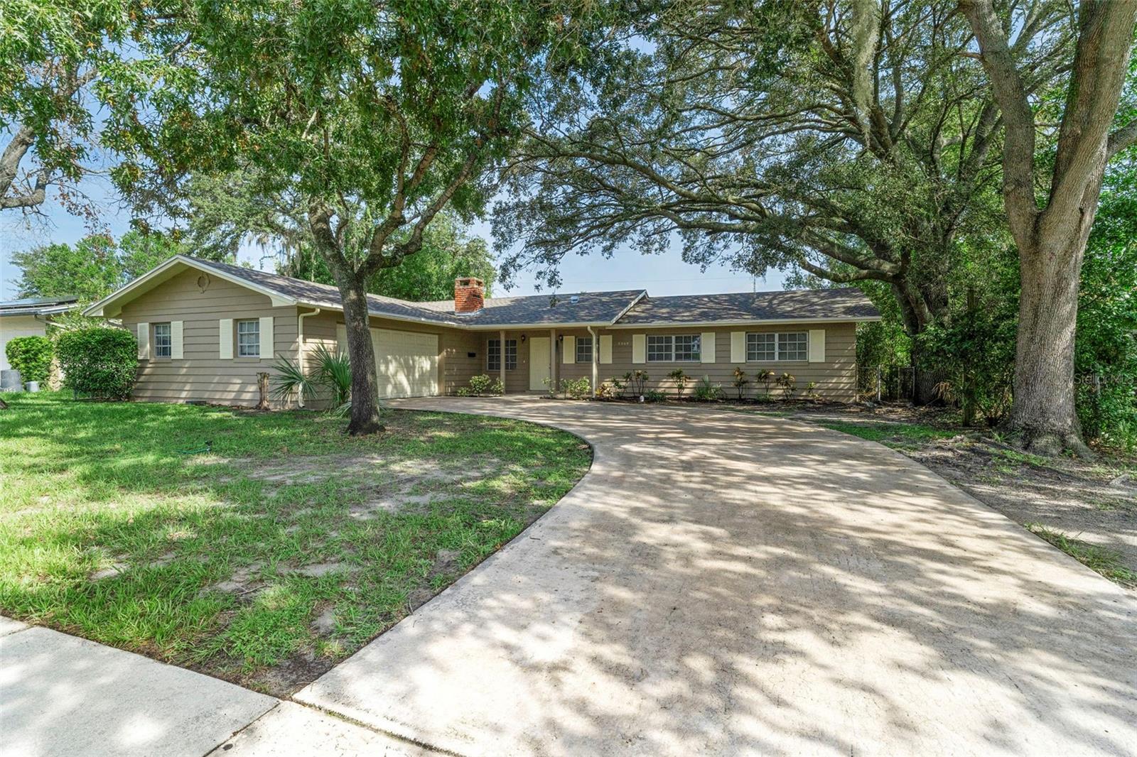 One or more photo(s) has been virtually staged. This lovely home combines fresh updates with inviting features in an established Orlando neighborhood. 4-bedroom, 2-bath home with a 2-car garage offers more than 1,600 square feet of living space and has been thoughtfully refreshed with a brand-new roof, new carpet in the bedrooms, and fresh paint. Modern tile flooring flows through the main living areas, creating a sleek and durable foundation for everyday living. The centerpiece is a cozy fireplace, adding warmth and character for gatherings and quiet nights alike.
The home’s versatile layout includes a spacious dining area, a functional kitchen, and four bedrooms that can adapt to your needs—whether for rest, guests, or a home office. Outside, the yard provides room to design your own retreat, garden, or play space, while the 2-car garage adds storage and convenience.
Located near shopping, dining, schools, and recreation centers, this property also offers quick access to downtown Orlando, I-4, and the 408. Parks, trails, and world-class attractions are just a short drive away, keeping both work and play within easy reach. With its recent updates, modern finishes, and central location, this home is move-in ready and waiting for its next chapter.