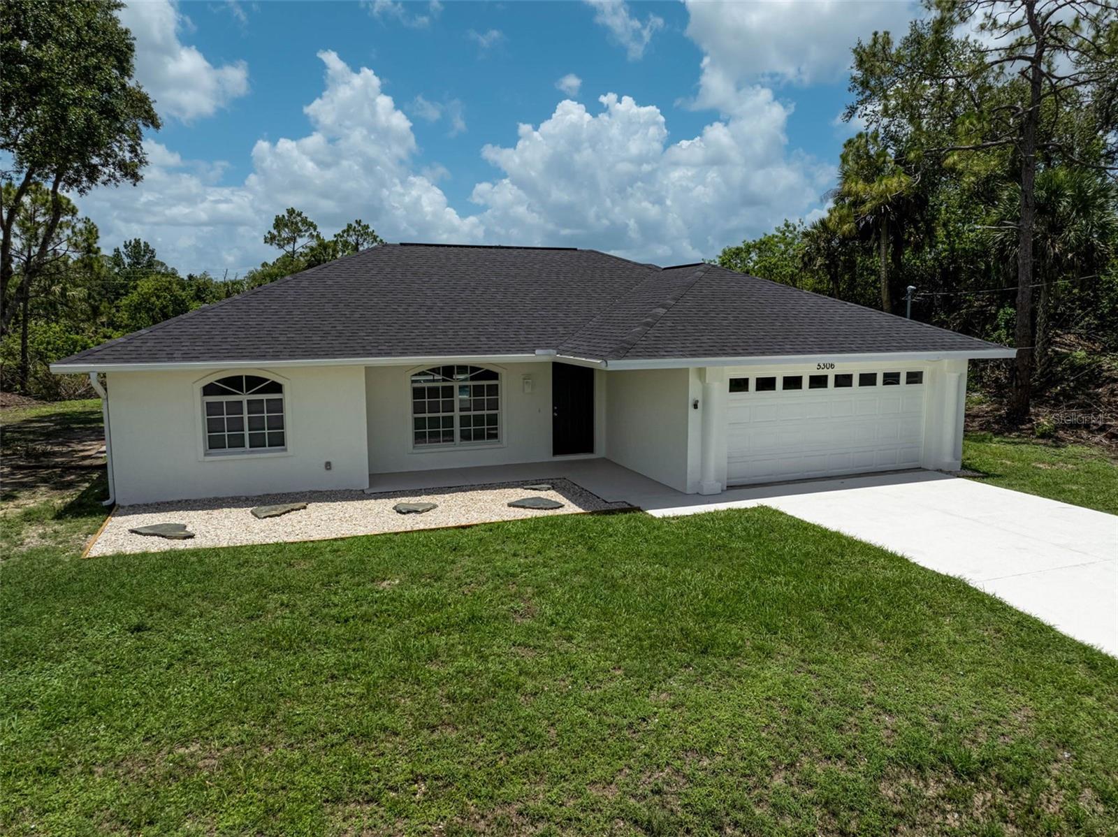 Discover your slice of paradise with this beautifully renovated canal-front home, complete with a private dock and sparkling pool. Freshly updated from top to bottom, this move-in ready gem features a brand-new roof, new appliances, new pool finish, fresh paint inside and out, and city water service for easy living. Step inside to a refreshed interior that blends comfort and style, perfect for relaxing or entertaining. Outside, enjoy direct canal access for fishing, kayaking, or simply soaking in the view. Even better-the vacant lot to the left conveys with the sale, offering extra space, privacy, or potential for future expansion. Located just minutes from shopping, dining, and daily conveniences, this home offers the best of both lifestyle and location. Don't miss this rare opportunity-schedule your private showing today!