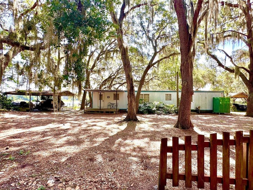 Check out this affordable North Florida LAKEFRONT property -a mobile home and almost half an acre lot on Cowpen Lake located just east of Hawthorne! Its an easy 30 minute drive on State Road 20 west to Gainesville or 30 minutes east to Palatka or 40 minutes south on Hwy 301 to Ocala from this lake getaway! The lake view from the screened in back porch is perfect to enjoy a cup of coffee and a beautiful east facing sunrise in the morning and the mature Oak tree cover gives shade to cool you from the noon day sun. The clean and cared for 2 bedroom/ 1 bathroom mobile home gives you a place to immediately begin using for a great little Florida lake getaway! A storage shed is also included which houses a washer & dryer, along with a carport for your lake toys or small boat. It is a great weekend getaway (when you come to town for Gator games), or you may choose to develop it into more and make it your full-time residence. Call today to get more information on how to make this your North Florida lake place!