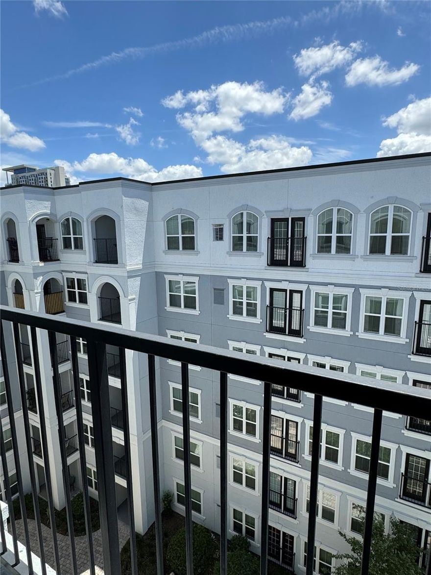 Location, location, ...Charming one bedroom one bath on top 6th floor with Balcony overlooking the courtyard. Laminated flooring in Living and Dining, Split bedroom plan, Full size washer/dryer hookup. The Grande Downtown is a gated condominium community close to Thornton Park, Sun Rail, major highways, Orlando’s top attractions and the Dr. Phillips Center for the Performing Arts—including the new Judson’s Live Jazz Bar, Lake Eola, a dog park just down the street off Jackson, restaurants, boutique shopping and stores, so many cultural, social, and sports activities at your doorstep to enjoy.
The entire community has undergone Recent exterior renovations (2020-21) including the installation of new windows, roofing, and fresh paint to ensure that the Owners will benefit for years to come.
The unit is located on a quiet side, with a garden view, and 2 parking spots.
The HOA includes water, sewer, trash pickup, pest control, exterior maintenance, and nighttime security, giving you peace of mind,
 24-hour gym, grilling areas, secured access, and onsite management. Perfect home for owner-occupants, first-time buyers, or investors who value location, convenience, and beautiful downtown lifestyle.