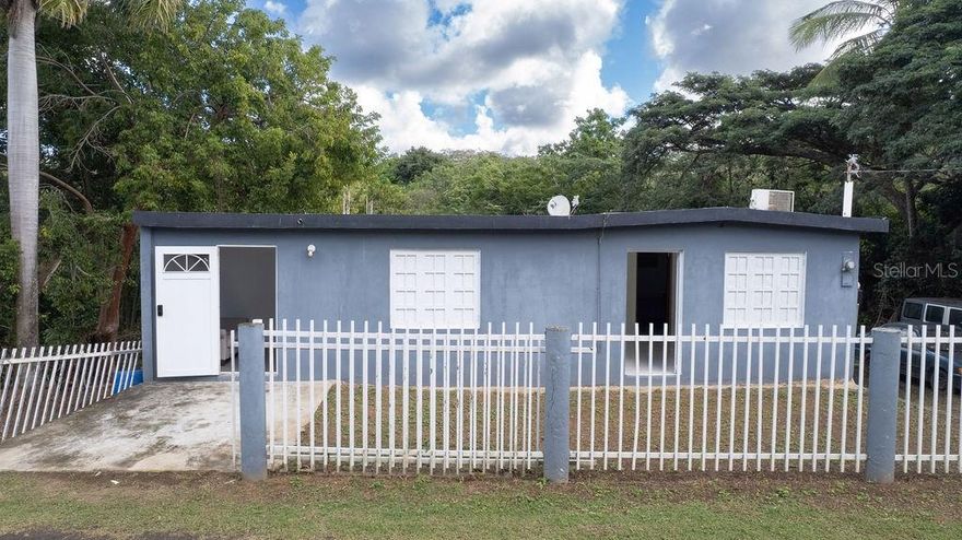 Nestled on a quiet street of Villa Borinquen with minimal through traffic, this spacious ranch-style home offers comfort, privacy, and abundant potential. The property backs up to a charming quebrada (creek), creating a serene setting and fertile land ideal for gardening, planting, or simply enjoying nature.

The home features three generously sized bedrooms and two full bathrooms, along with a large kitchen and living area that provide a solid foundation for customization. A dedicated storage area is perfectly suited for a laundry room. The layout currently has one of the bedrooms and bathrooms separated in it’s own private wing of the house with its own entrance.  The space can be opened up to create a more spacious home of converted into an income-producing studio apartment with a small kitchenette.

Outside, the spacious 8,227 sqft yard offers endless possibilities, whether you envision expanding the home, creating a lush garden, or adding a pool and outdoor terrace. The property also features a convenient and secure gated off-street parking with ample space for multiple cars.

With its peaceful setting, flexible layout, and strong upside potential, this property offers endless possibilities for homeowners, investors, or anyone ready to create something special.