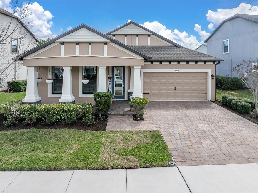 Rarely does a home with this level of finish, condition, and location come to market in Starkey Ranch. With exceptional upkeep, thoughtful upgrades, and proximity to parks and amenities, this residence stands out as one of the most move-in ready opportunities currently available in the community.

Built by the respected CalAtlantic Homes and completed in 2019, this beautifully maintained Craftsman-style residence offers quality construction and thoughtful design in the heart of Starkey Ranch. With brand new exterior paint and a refreshed interior, this one-story home lives like new and is truly move-in ready. Offering 3 bedrooms, 2 bathrooms, and over 2,000 square feet, the home blends elegant finishes with a highly functional open floorplan designed for comfortable Florida living.

The charming Craftsman architecture, paver driveway, and welcoming front porch with recently sealed pavers create exceptional curb appeal. Inside, soaring ceilings, abundant natural light, and stunning wood-look tile flooring flow throughout the entire home. With no carpet anywhere, the result is a clean, modern aesthetic that feels both elevated and low maintenance. Just off the foyer, the flexible dining room with tray ceiling can serve as a formal dining space, home office, or additional sitting area.

The expansive great room opens to the kitchen and casual dining area, creating the perfect environment for entertaining or everyday living. A custom feature wall, designer lighting, and upgraded ceiling fans add architectural character. The gourmet kitchen features built-in double ovens, natural gas cooktop, tile backsplash, deep sink, large center island with seating, and elegant full-overlay cabinetry offering abundant storage.

Triple sliding glass doors lead to the extended covered lanai overlooking the fully fenced backyard with St. Augustine grass, creating an inviting outdoor space for relaxing evenings, entertaining guests, or future plans for a pool or outdoor oasis.

The private primary suite overlooks the backyard and features a spacious layout with natural light. The ensuite bath includes quartz counters, double vanity, glass-enclosed shower, water closet, and a walk-in closet with a custom organization system. The split floorplan places the two additional bedrooms at the front of the home with a shared bath finished with the same upscale touches found throughout.

Additional features include plantation shutters, Hunter Douglas shades on the rear windows, designer lighting and ceiling fans, a separate laundry room, and a two-car garage with ample storage. Mechanical upgrades include a natural gas tankless water heater, in-wall pest control system, dual-pane energy-efficient windows, all block construction, a dimensional shingle roof, custom gutters, hurricane shutters, and underground utilities. The yard is irrigated with reclaimed water averaging approximately $12 per month.

Located just one block from one of Starkey Ranch’s parks, residents enjoy easy access to green space, trails, and community amenities. Within the 2,500-acre Starkey Ranch community, residents enjoy more than 800 acres of preserved nature, 22 miles of paved trails, multiple parks, resort-style pools, splash pads, dog parks, and vibrant gathering spaces.

Homes in this section of the neighborhood rarely become available in this condition, offering a rare opportunity to enjoy elevated living in Starkey Ranch. For more information bit.ly/12396Fitzroy