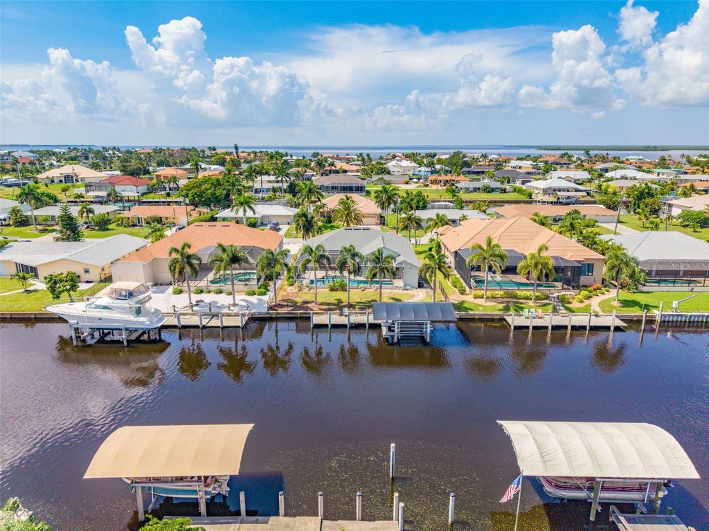 Photo of 136 Peckham Street SE, Port Charlotte, FL 33952 (MLS # C7529713)