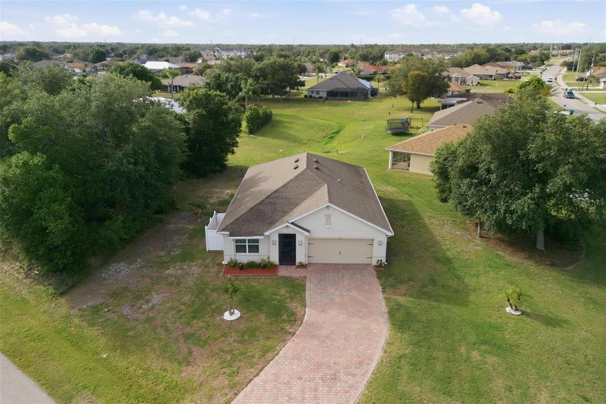 Welcome to this meticulously maintained, newer-built home situated on an oversized lot in the highly desirable community of Deep Creek. Built in 2021, this 3-bedroom, 2-bath residence offers a 2-car garage, oversized driveway, and just under 1,700 square feet under air. Being sold turnkey furnished, this home is truly move-in ready—just bring your personal belongings.

A desirable split-bedroom floor plan provides privacy for both owners and guests. A screened entryway welcomes you inside, while the screened-in lanai overlooking a peaceful greenbelt offers the perfect space to relax and enjoy Florida living year-round.

The interior features an inside laundry room and thoughtful upgrades, including enhanced lighting throughout and recessed soffit lighting on the exterior, adding a modern and elegant touch.

The garage is finished with durable epoxy flooring, and the home is equipped with a generator plug-in connection for added peace of mind.

This well-cared-for home reflects true pride of ownership and is ready for its new owners. Conveniently located near shopping, dining, golf, and fishing, and just minutes from Punta Gorda Airport.

Low HOA fee of just $210 annually adds to the appeal.