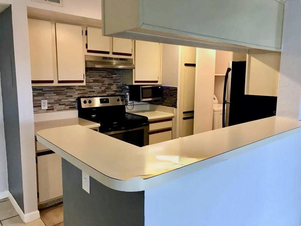 Photo of 4460 Perkinshire Lane #T206, Orlando, FL 32822 (MLS # O6400732)