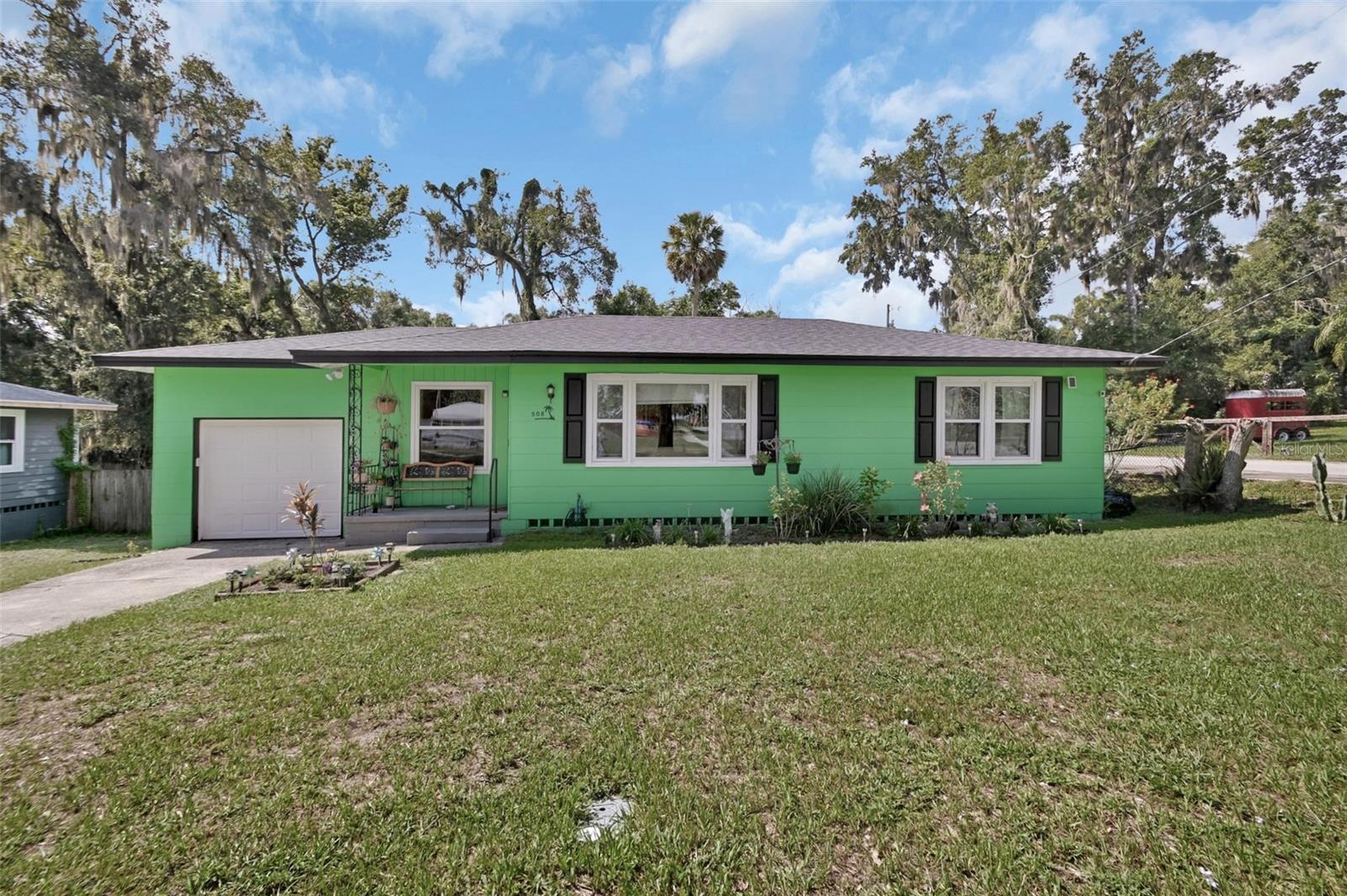 This 3-bedroom, 1-bath home is full of charm and move-in ready comfort. Thoughtfully well-maintained, it offers a newer roof, fresh paint outside, and stylish wood floors in the bedrooms with tile throughout the rest. Recent updates include a new hot water heater, replaced windows, and a new garage door and opener for added efficiency and peace of mind. Sitting on a corner lot with a fully fenced backyard, it’s perfect for outdoor living, pets, or a garden. Great for first time home buyer or needing to downsize. Just minutes from vibrant downtown DeLand, you’ll love the convenience of shops, dining, and entertainment right at your doorstep.
Surveillance cameras on property exterior and interior