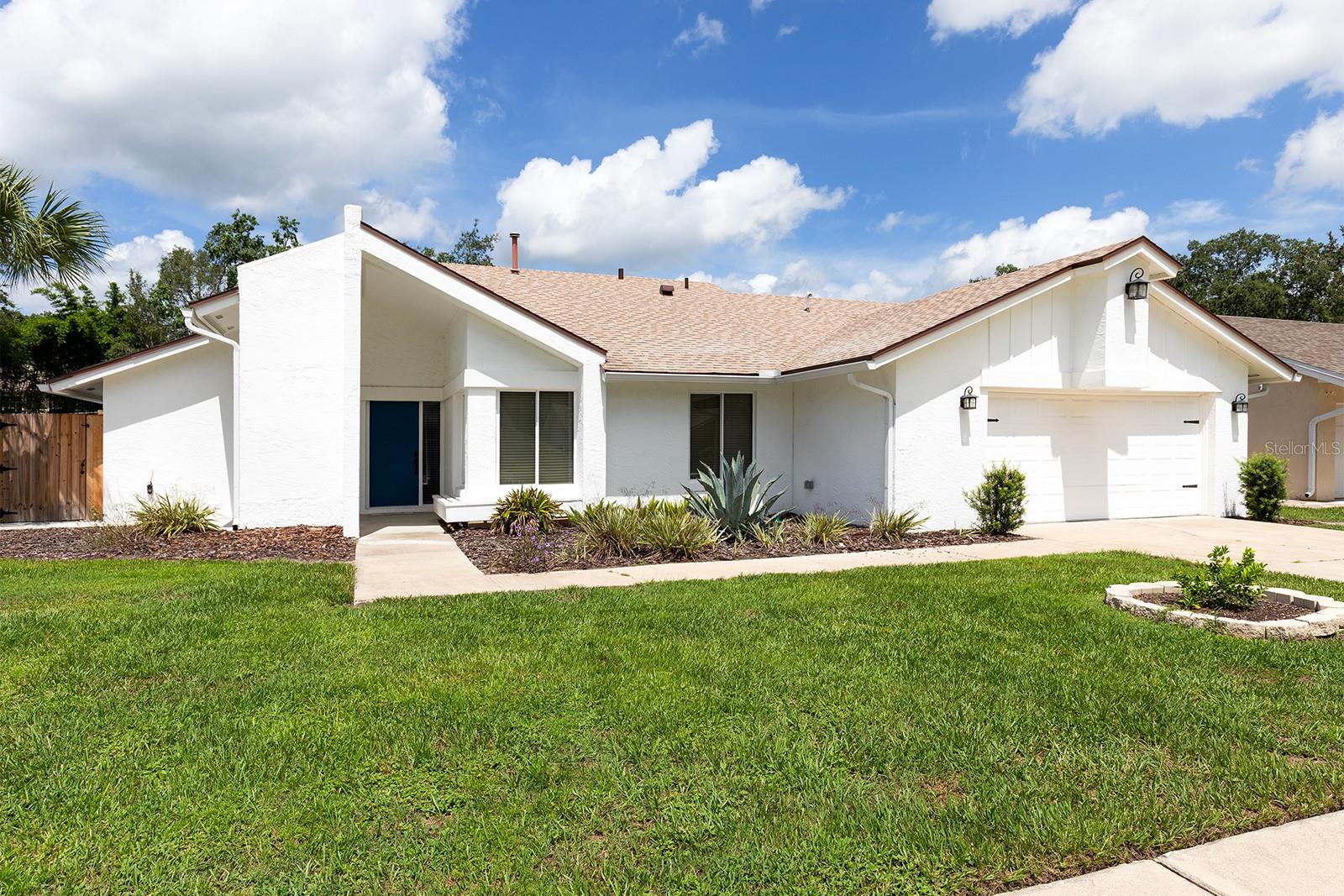 One or more photo(s) has been virtually staged. Discover your perfect first home or dream downsizing opportunity in Lake Mary! Modern, Light, Bright & Move-In Ready! This beautifully renovated 4 bedroom 2 bath home offers a spacious 2-car garage and huge fenced backyard! Sleek luxury plank vinyl floors throughout (no carpet!), offering you the elegant look of hardwood with low maintenance and durability! The chef-inspired kitchen shines with granite countertops, chic backsplash, built-in breakfast bench and newer stainless appliances. The cozy wood-burning fireplace sets the scene for memorable family moments. Both bathrooms are spa-inspired, with fresh fixtures and stylish tile that create a serene escape. Key Upgrades include: Luxury vinyl plank flooring throughout are durable yet quiet underfoot—and perfect for pets or high traffic areas. Whole house water softener installed in 2025, New roof (2021) provides long-term peace of mind, New paver walkway linking to a huge fenced backyard—ideal for play, pets, potential pool, or nights on the screened porch. Located in the heart of Lake Mary, this home gives you unbeatable access to I-4, 417, Sun Rail, the Farmers Market, dining, shopping, fantastic Lake Mary Schools, Seminole Wekiva Trail and more—combining suburban ease with modern convenience. Low HOA dues! Don’t miss your chance—hurry come see!