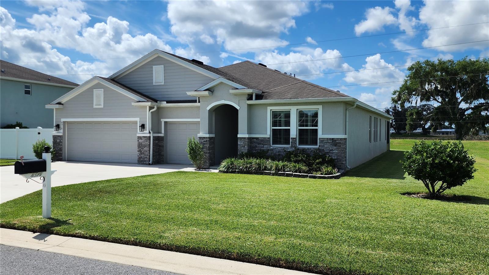 Spacious Multi-Generational Home with Private Guest Suite
This thoughtfully designed 4-bedroom, 3.5-bath home offers the perfect blend of flexibility, privacy, and modern comfort—ideal for multi-generational living or extended guest stays. Located in a highly desirable community near SR 200 with easy access to shopping, dining, medical, and more, this meticulously maintained home is move-in ready and loaded with upgrades.
A standout feature of this property is the fully equipped in-law suite, complete with its own private entrance, full kitchen, living room, bedroom, and bath—an exceptional opportunity for multi-gen families, visiting guests, or even potential rental income.
Inside the main home, you'll find a spacious open-concept layout featuring a gourmet kitchen with granite countertops, a large center island, walk-in pantry, and stainless steel appliances. The adjoining dining room and great room, anchored by a beautiful fireplace and custom mantle, offers plenty of space for entertaining or quiet nights in. Luxury vinyl waterproof flooring adds durability and elegance throughout much of the home.
Additional highlights include upgraded lighting and ceiling fans, an extended 3-car garage with an epoxy floor and side entry (man door), and a covered lanai perfect for enjoying Florida evenings.
Whether you're looking for flexibility, comfort, or a true dual-living solution, this home delivers. Agent Owned.