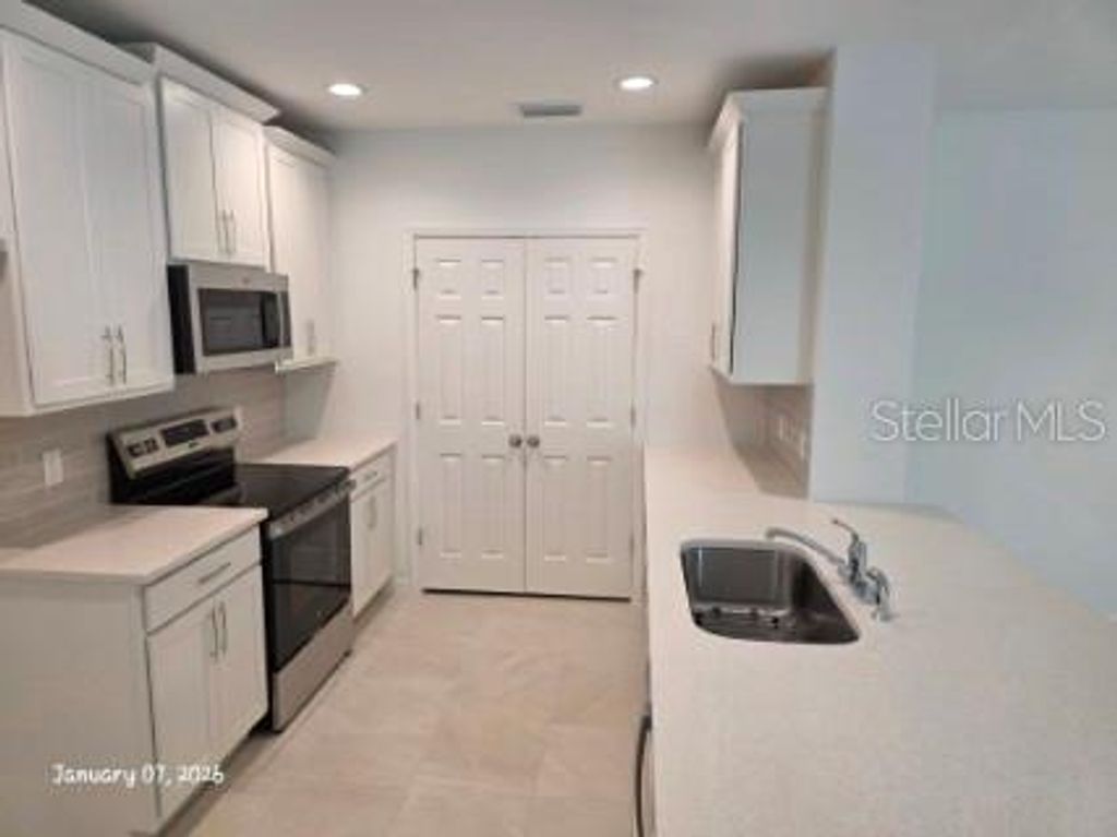 Photo of 1337 Sawgrass Hammock Lane, Davenport, FL 33837 (MLS # O6378614)