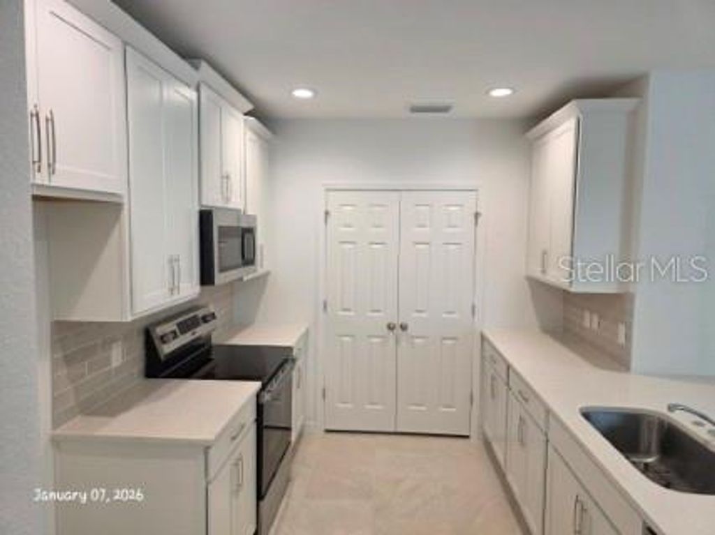 Photo of 1337 Sawgrass Hammock Lane, Davenport, FL 33837 (MLS # O6378614)