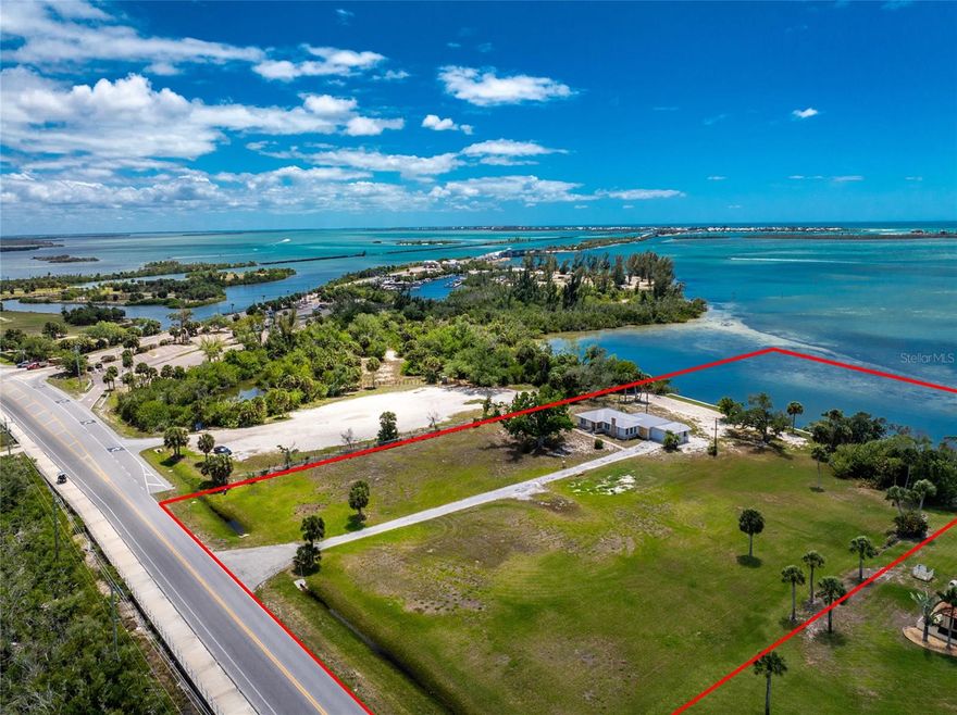 A Once in a Lifetime Waterfront Opportunity Near the Boca Grande Causeway, Offering 4.37± Acres with 2.49± Acres of Uplands and 1.88± Acres of Submerged Land. Offering direct access to local sandbars, Charlotte Harbor’s world class tarpon fishing, and open Gulf waters, this setting creates the perfect backdrop to create a one of a kind retreat. The existing home reflects a piece of Florida’s past and has experienced significant storm damage, presenting an opportunity for a restoration or complete redevelopment. Hardwood flooring, French doors, and built-in cabinetry offer glimpses of its original character. Mature trees frame the property, creating a sense of privacy and a connection to its history. While the structure remains, the true value lies in the land, the expansive water views, and the rare setting that is increasingly difficult to find. The submerged land ownership is a valuable advantage, potentially streamlining the process for future dock construction or other waterfront improvements. Panoramic water views stretch across the bay toward Boca Grande, creating a setting that is truly unmatched. The 2025 concrete seawall provides a strong foundation for a future dock and boat lift, where you can be on the water within minutes, enjoy sunset cruises from your backyard, or spend the day exploring the surrounding islands. Dolphin, osprey, and manatee are frequent visitors, adding to the natural beauty that surrounds you. Beyond the property, the location places you at the center of a lifestyle rich in history and charm. Just across the bridge, Boca Grande is known for its quiet elegance, uncrowded beaches, and the legendary Gasparilla Inn and Club, a landmark destination that has welcomed generations with fine dining and championship golf. The nearby Boca Grande Marina provides full service amenities for boaters, while Coral Creek Club and Lemon Bay Golf Club offer exceptional golf experiences set within beautifully preserved natural surroundings. For those traveling by air, Coral Creek Airport is just minutes away, offering convenient private plane access. In nearby Englewood, you will find a variety of activities including golf, pickleball, waterfront dining, and tiki bars, along with convenient access to shopping and medical facilities for comfortable, everyday living. With 4.37± acres, the property offers exceptional flexibility whether you envision renovating what is here, creating a brand new private estate with a pool and guest home, or exploring potential subdivision opportunities. Positioned at the gateway to Boca Grande, 12500 Placida Road is a rare opportunity to own a property that reflects a bygone era and shape it into something truly special.
