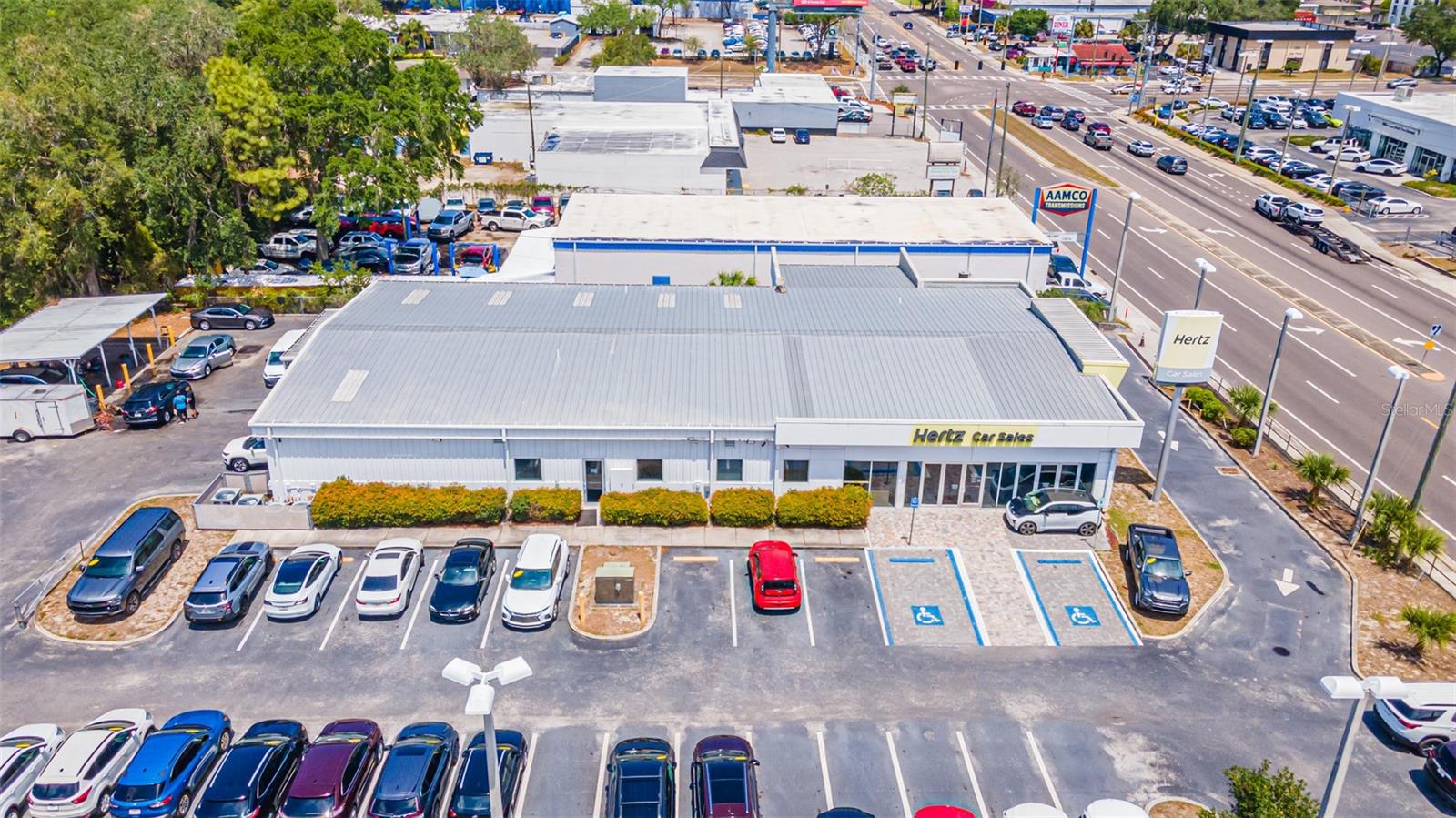 Prime Investment Opportunity with Single Tenant Net Leased Retail Investment Offering. This property is located in Prime location for auto dealership. Located on N Florida Avenue, just south of Fowler Ave. in Tampa. Referred often as the “Motor Mile” and has neighboring dealerships including: Tesla, BMW, Porsche, Mazerati, Audi, Land Rover, VW, Subaru, Acura, Nissan, Lincoln, Chevrolet & Ford to name just a few. This is an immaculate automobile dealership property occupied by The Hertz Company for the past 10 years, and with 2- 5 year renewal options that include rent increases with each option term. The facilities include 6 individual Sales Offices with spacious Showroom Floor, Service Department with 7 Service Bays, Parts Department, Customer reception and waiting area and a spacious employee kitchen and breakroom. Metal roof and walls, A/C system are 6 years old. Over 200+parking spaces. The site benefits from its excellent visibility and frontage along Florida Ave (26k VPD) and its corner location provides excellent access. Minutes from the vibrant Downtown Tampa metro and a 20-minute drive to Tampa International Airport.