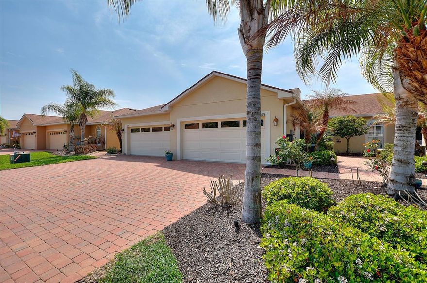 BETTER THAN NEW!!!  Why wait to build when you can move into this HIGHLY UPGRADED, MAINTENANCE FREE villa in the 55+ GATED COMMUNITY of Vienna Square, centrally located in Winter Haven, FL.  Before entering this beautiful residence, you will notice the BRICK PAVERED driveway/walkway leading through the MATURE LANDSCAPE and CUSTOM LIGHTING to the front SCREENED LANAI.  Walk right into this very OPEN FLOORPLAN with HIGH CEILINGS and SPLIT BEDROOM CONCEPT.  The kitchen is a CHEF'S DREAM, featuring UPGRADED STAINLESS APPLIANCES, IMPRESSIVE WINE FRIG., and BREAKFAST BAR.  The CASCADING WATERFALL EDGE QUARTZ COUNTERTOPS add a MODERN, ELEGANT and LUXURIOUS focal point to this AMAZING KITCHEN!!! The adjoining great room is very spacious and overlooks the rear SCREENED LANAI with a view of the pond.  The primary en-suite will not disappoint which also features QUARTZ COUNTERTOPS and an UPGRADED WALK-IN SHOWER with GLASS DOOR.  CUSTOM PLANTATION SHUTTERS in the kitchen and bedrooms ensure you have the privacy you deserve!  Don't forget about the second bathroom that has also been UPGRADED with QUARTZ COUNTERTOPS as well.  This residence is truly TURN-KEY and one of the most WELL KEPT, ONE-OWNER homes you'll find anywhere.  The reasonable monthly HOA dues include: ROOF REPLACEMENT, EXTERIOR PAINTING, YARD MAINTENANCE, LAWN IRRIGATION, and INTERNET/TV PACKAGE!  Enjoy the other amenities including, but not limited to: pool/hot tub, tennis/pickle ball, gym, craft room, billiard room, movie room, and large meeting room with remodeled kitchen area.  This wonderful property is in close proximity to medical, restaurants, shopping, worship, and LEGOLAND, FL.  Winter Haven is well-known for it's beautifully interconnected lakes and being centrally located between the Tampa International and Orlando International Airports.